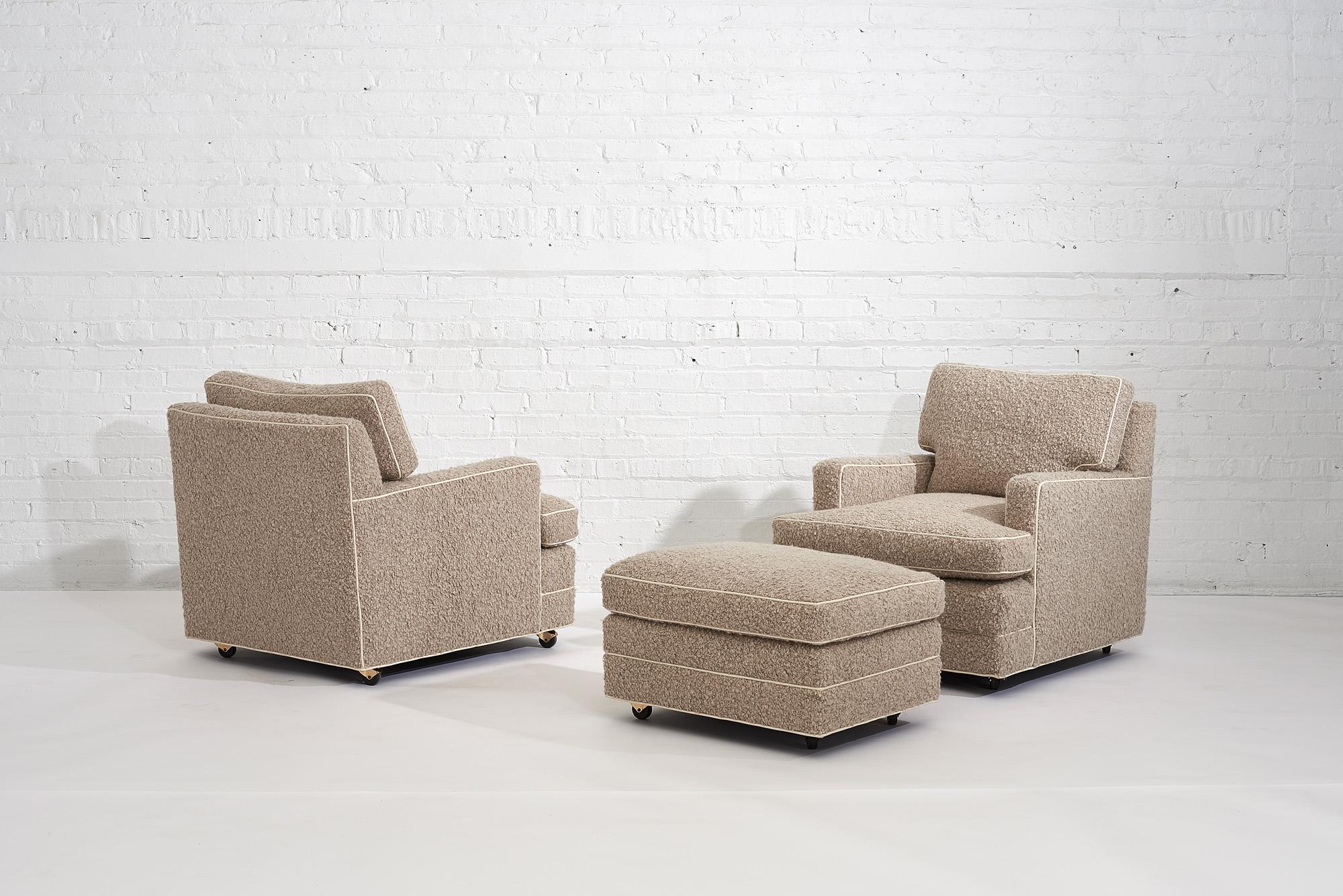 Dunbar lounge chairs with ottoman by Edward Wormely. Down filled chairs are upholstered in beige boucle white leather piping. Chairs are extremely comfortable.
Ottoman measures: 27.5” wide, 21” deep and 16” tall.