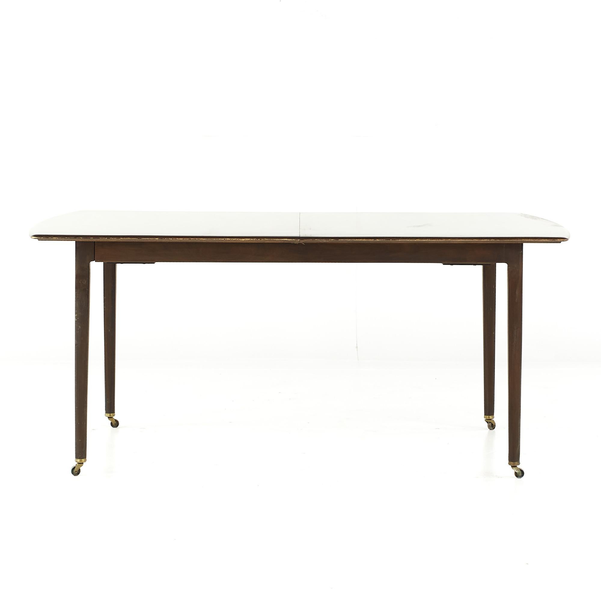 Dunbar Mid Century Expanding Hidden Leaf Walnut Dining Table with 2 Leaves

This table measures: 64 wide x 42 deep x 28 high, with a chair clearance of 25 inches, each/the leaf measures 19 inches wide, making a maximum table width of 102 inches when