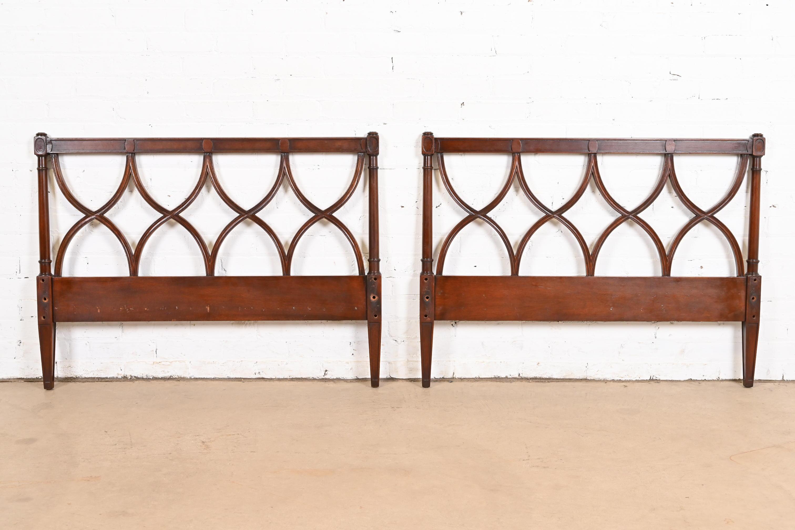 A gorgeous pair of mid-century French Regency Louis XVI style carved mahogany twin size headboards

By Edward Wormley for Dunbar

USA, Circa 1940s

Each measures: 41.75