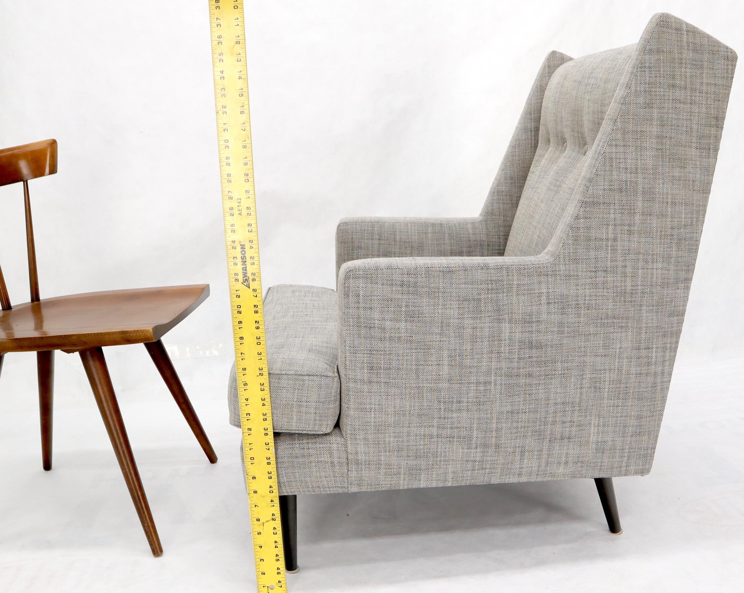 Dunbar Mid-Century Modern lounge chair on solid brass cone shape legs by Edward Wormley.