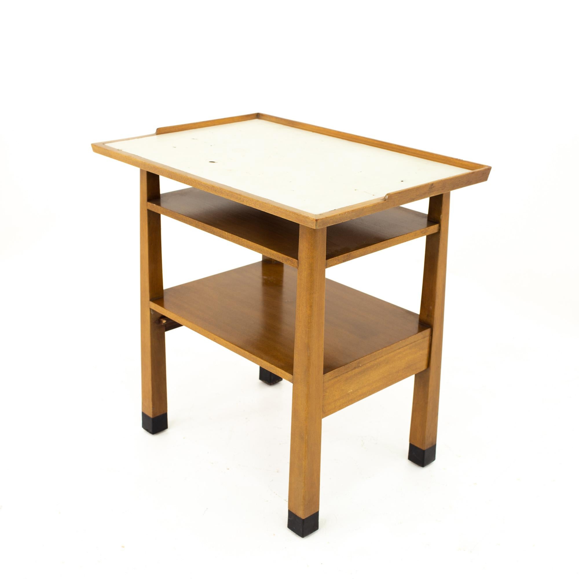 Dunbar Mid Century walnut and white laminate side end table
Table measures: 26 wide x 18 deep x 27 high

All pieces of furniture can be had in what we call restored vintage condition. That means the piece is restored upon purchase so it’s free of