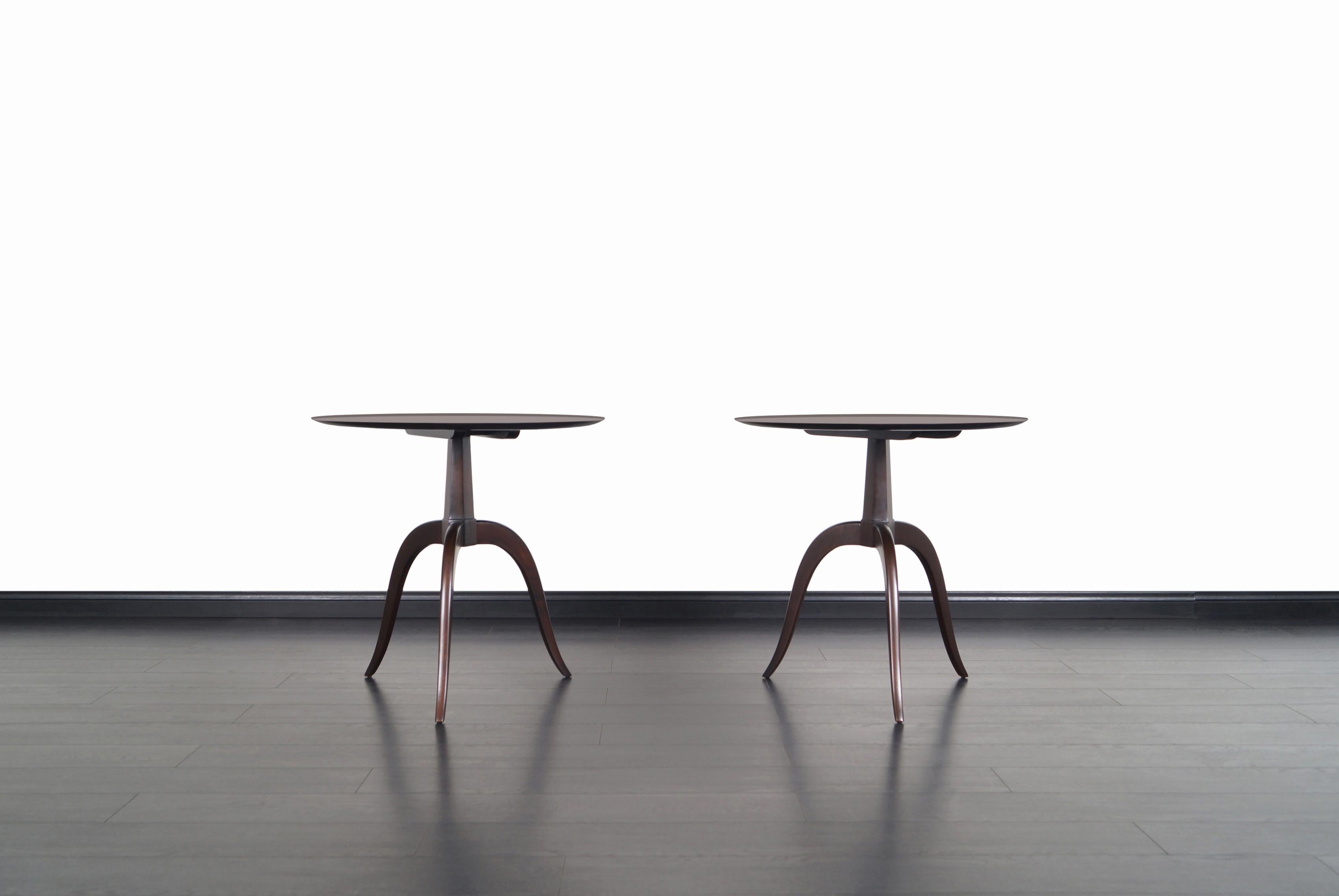 Elegant pair of vintage side or occasional tables designed by Edward J. Wormley for Dunbar in the United States. These extraordinary tables, also known as model #2010, feature a number of fine details that give these pieces a delightful sculptural