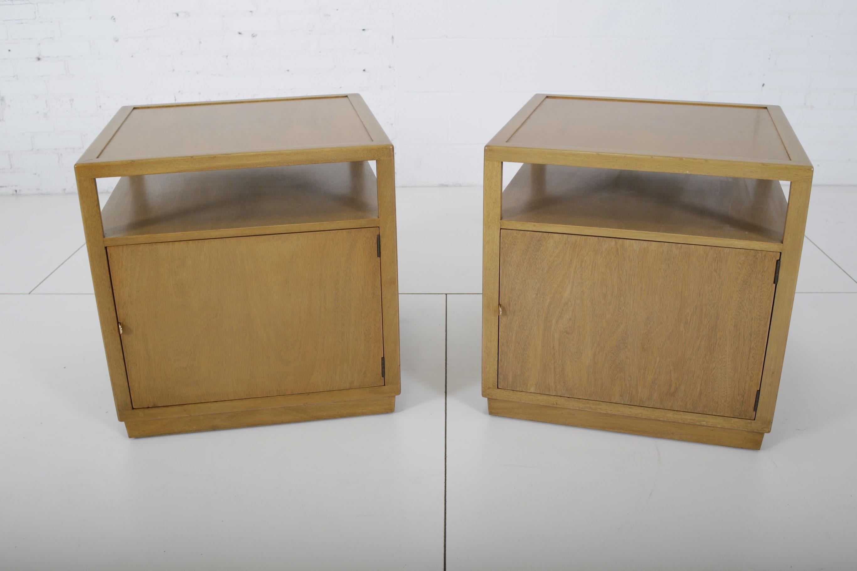 Pair of end table/nightstands by Edward Wormley for Dunbar. Fully restored. Both have a single shelf with storage cabinet below.