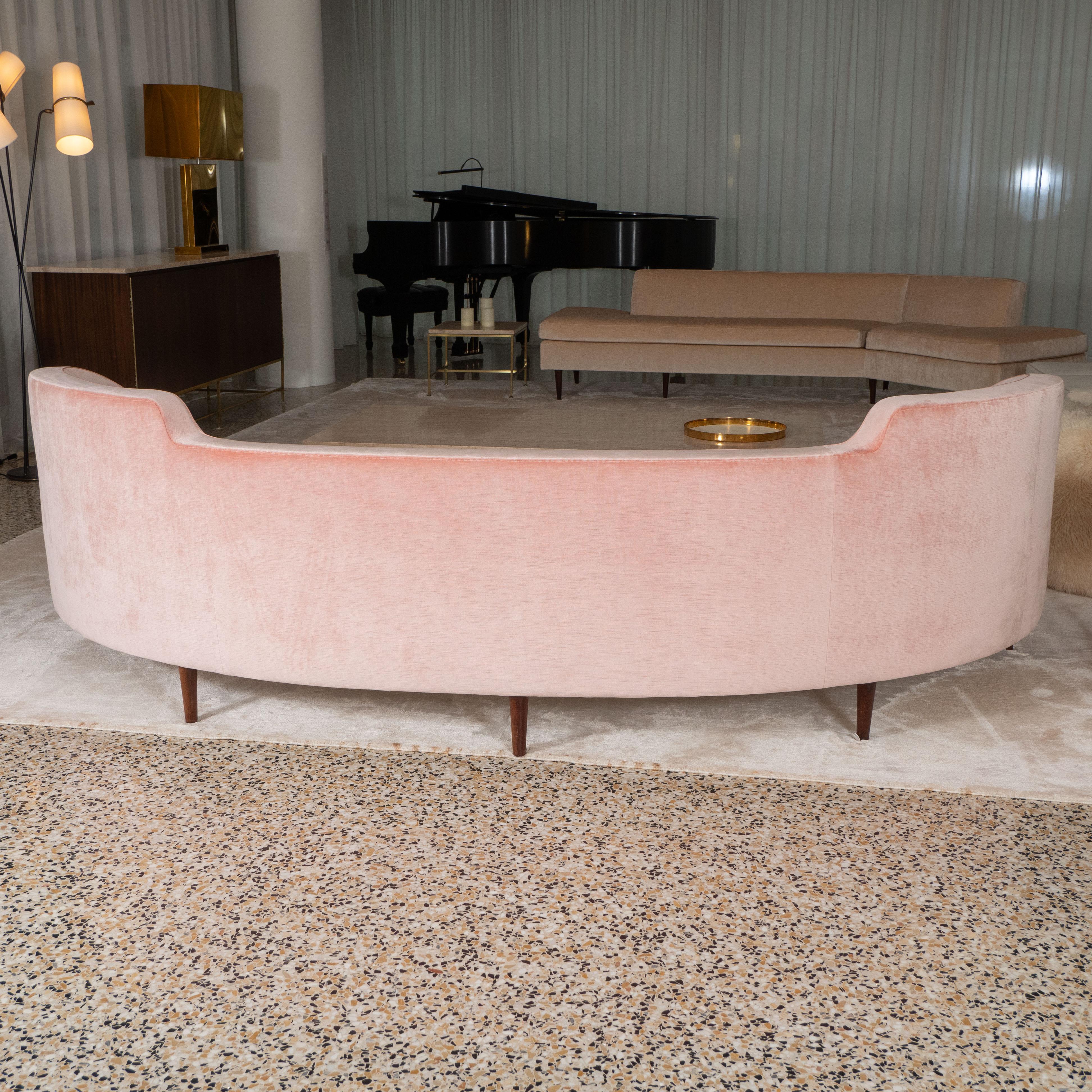 A vintage Oasis curved sofa designed by Edward Wormley for Dunbar. USA, circa 1950.

Recently re-upholstered in pink mohair.

