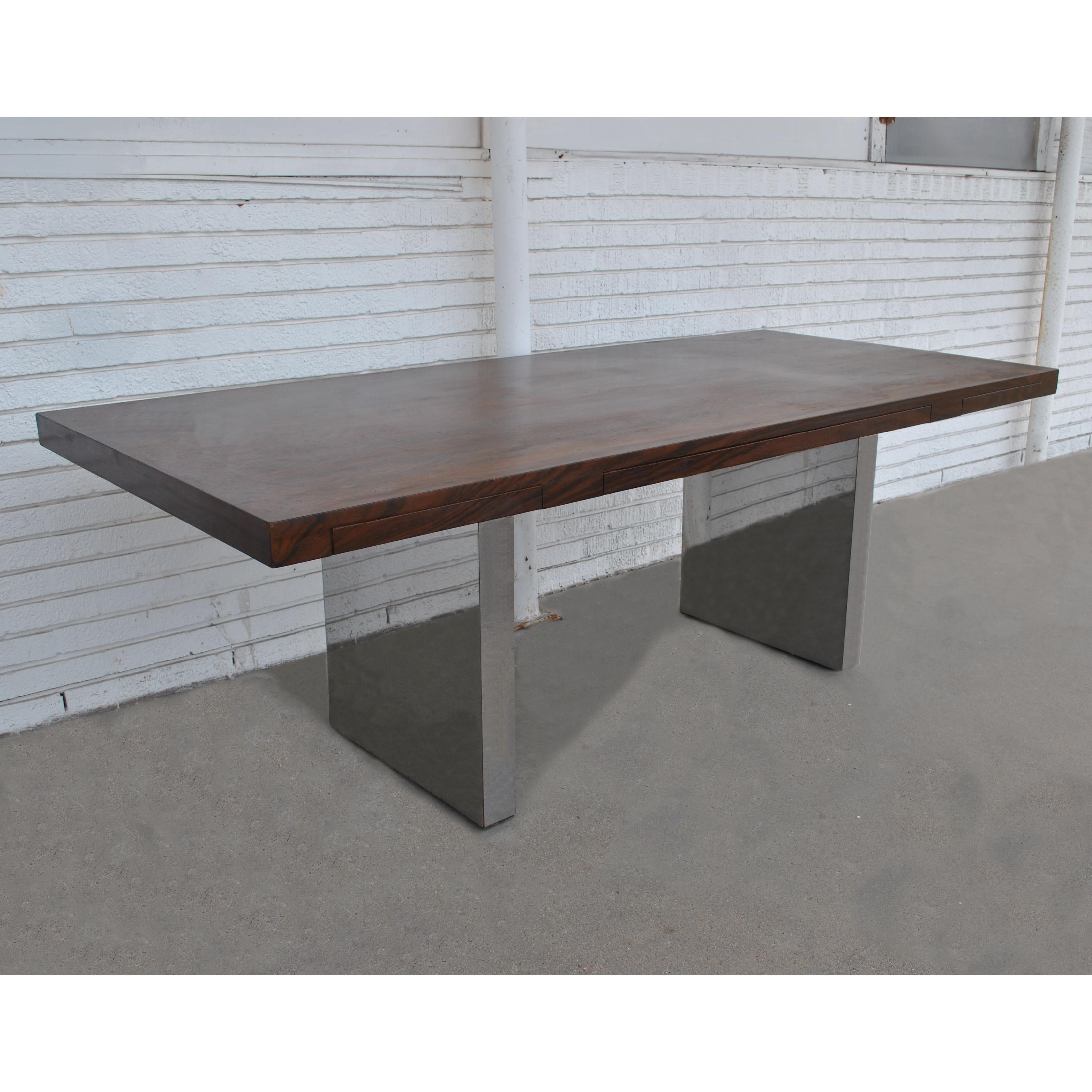 Vintage midcentury Roger Sprunger rosewood chrome table writing desk by Dunbar
1970s 

Executive desk in rich rosewood veneer with three drawers over legs in polished chrome. 
We also have a rosewood credenza available. See last photo.

