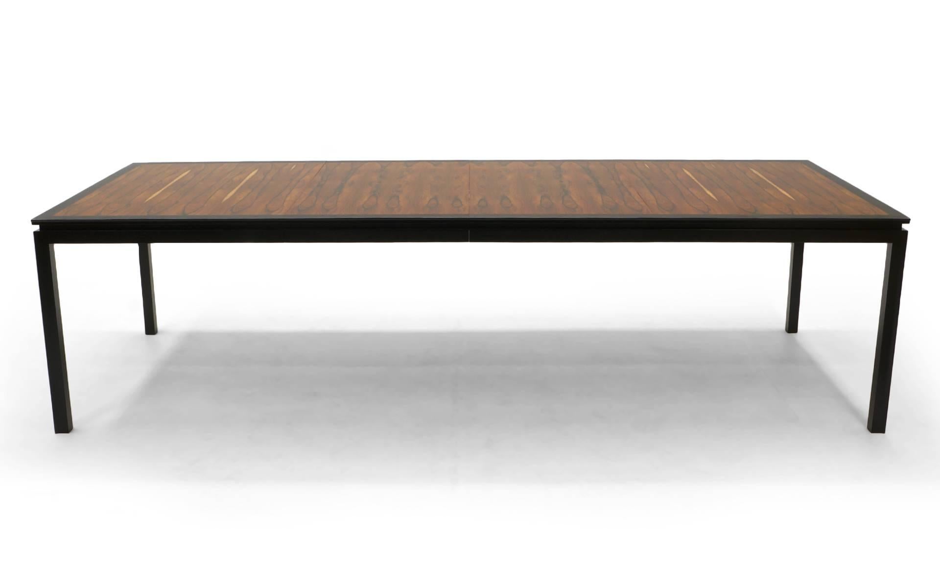 Edward Wormley for Dunbar Brazilian rosewood dining table. Table is 66 inches long and has two 19 inch leaves thus expanding up to 114 inches. Expertly restored and refinished. It is extremely rare to find this design in Brazilian rosewood. This is