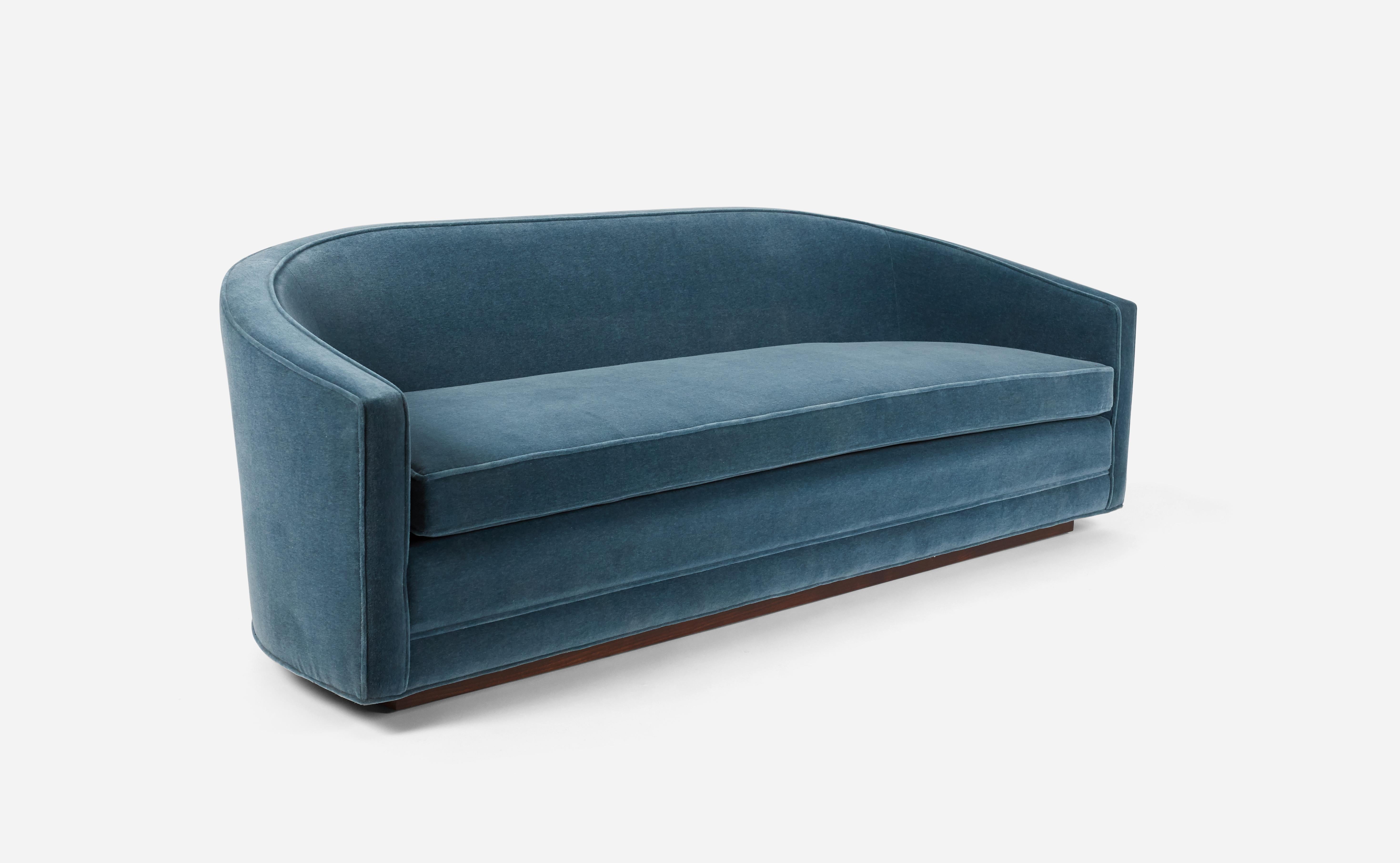 Barrel back sofa by Edward Wormley for Dunbar. Fully restored. Refinished and reupholstered. Gorgeous blue mohair on walnut base.