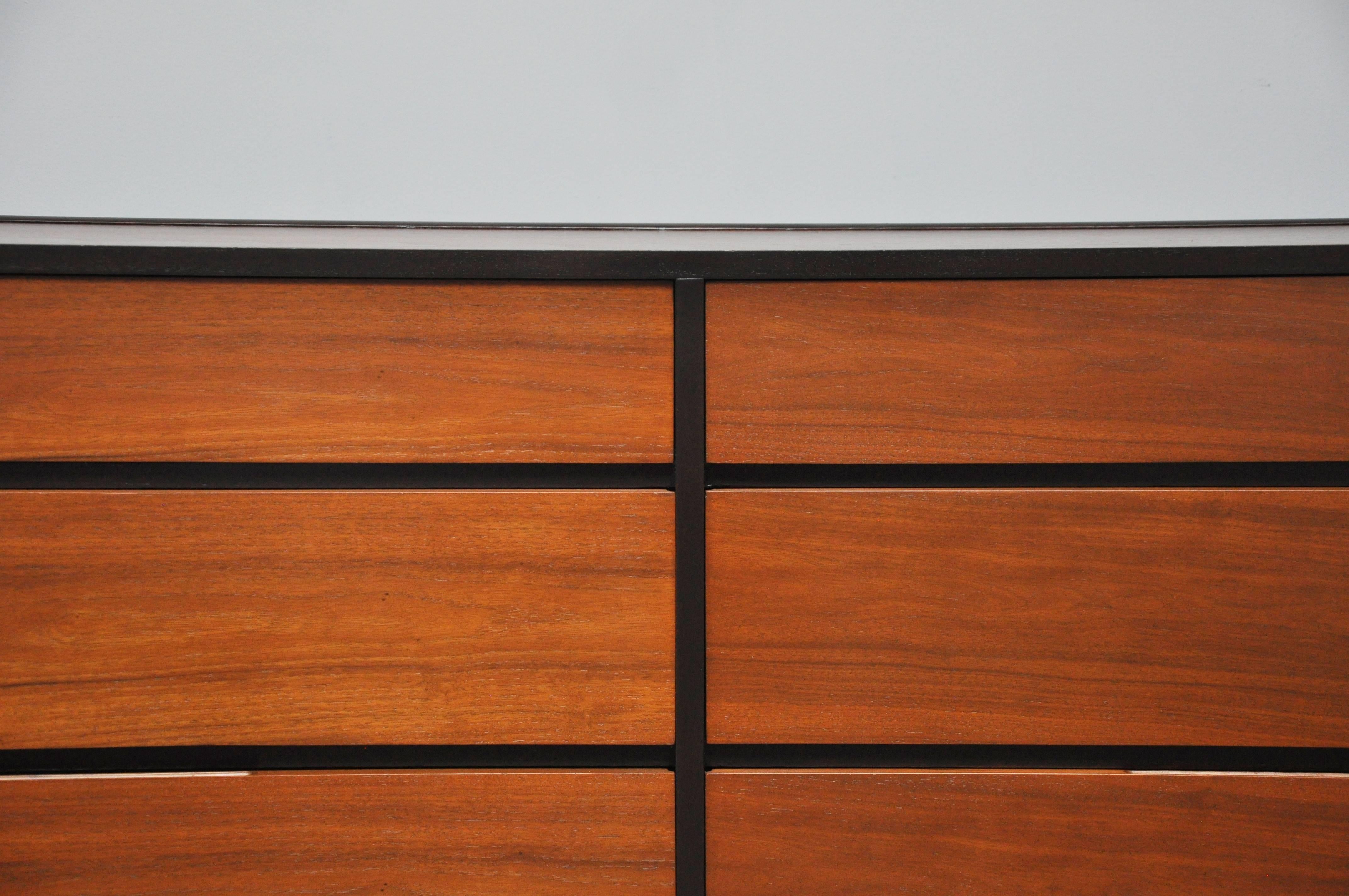 Beautiful six-drawer dresser by Edward Wormley for Dunbar, circa 1960. Dark espresso mahogany cases with natural walnut drawer fronts and top, giving a striking contrast. Fully restored and in excellent condition.
 