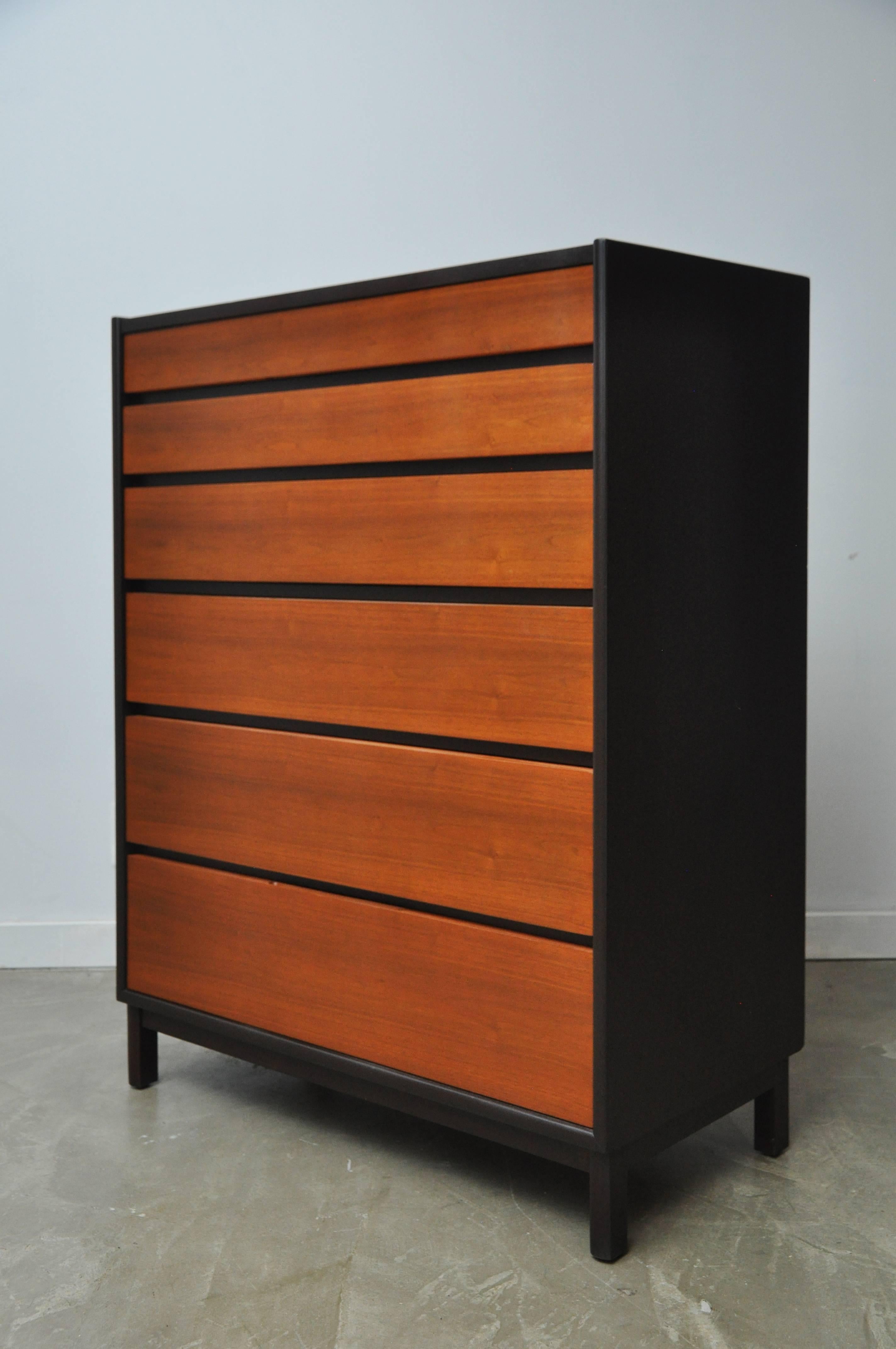 Beautiful six-drawer tall dresser by Edward Wormley for Dunbar, circa 1960. Dark espresso mahogany cases with natural walnut drawer fronts and top, giving a striking contrast. Fully restored and in excellent condition.
 