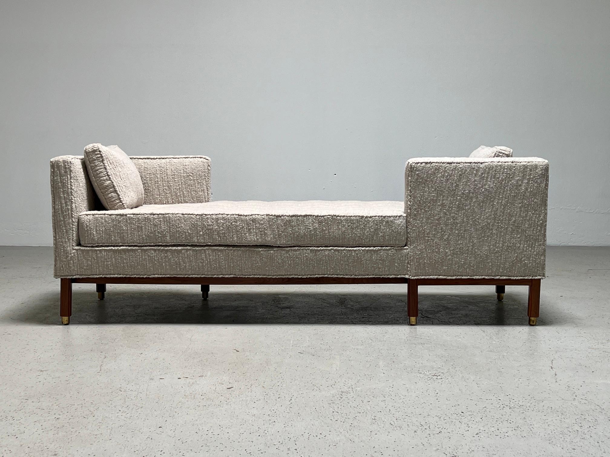 Tete-a-Tete sofa / daybed with walnut base and brass feet. Reupholstered in Holly hunt Riccardo/Champagne fabric. Designed by Edward Wormley for Dunbar. 