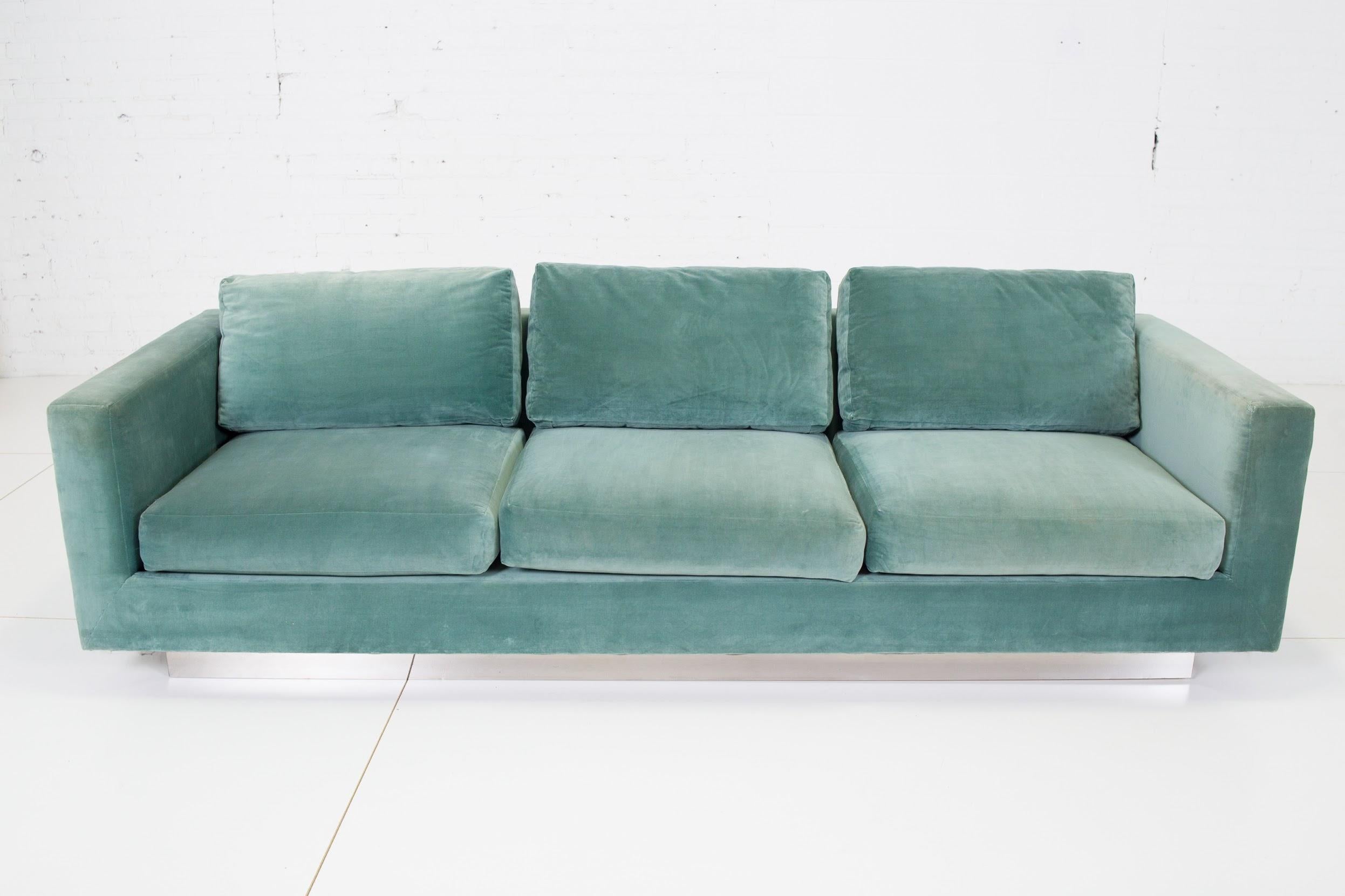 Tuxedo sofa by Edward Wormley for Dunbar. Original teal cotton velvet is in great shape, as is the chrome base.

25