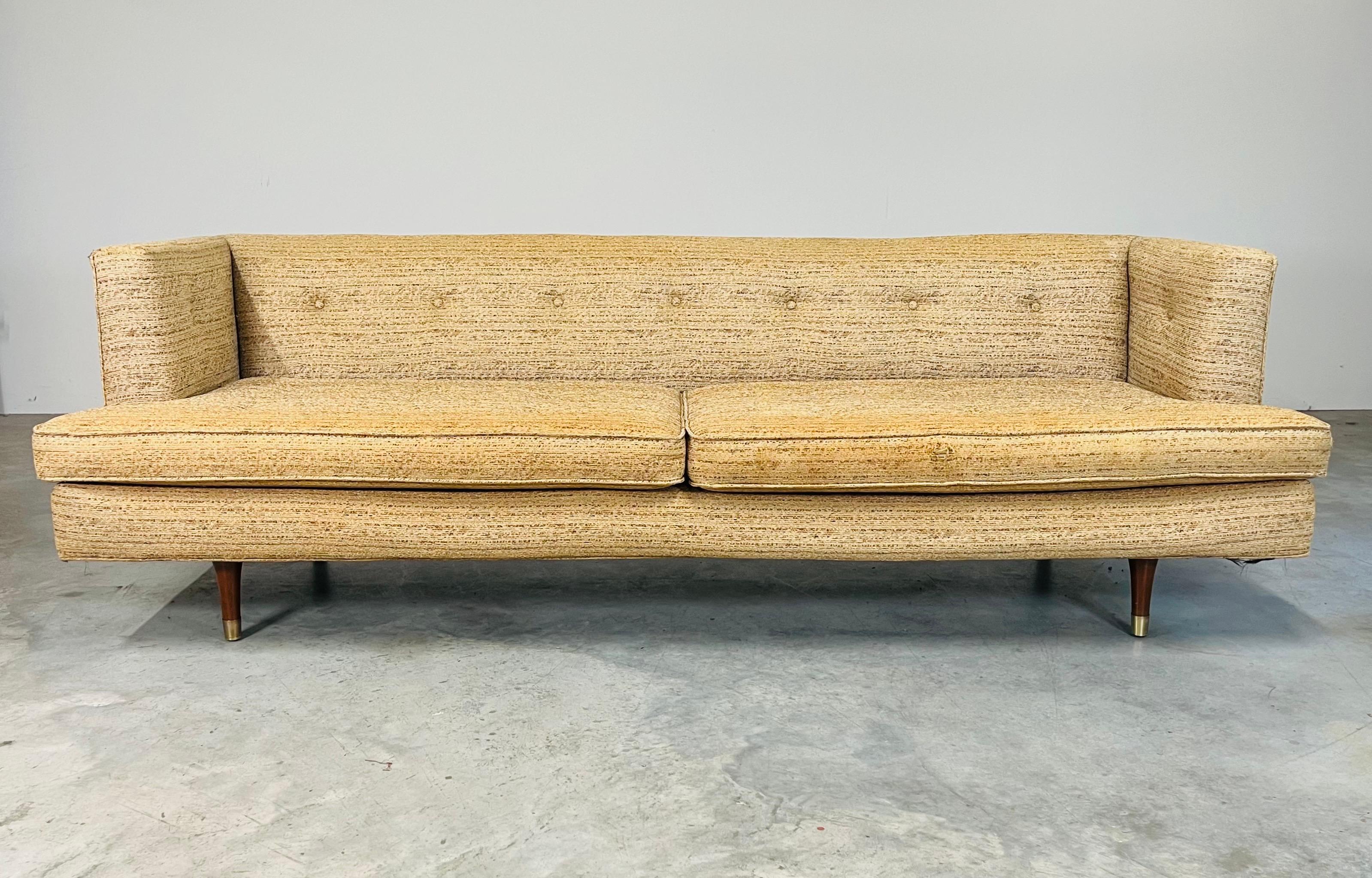 The exceptional #4907 sofa designed by Edward Wormley for Dunbar at 90” takes the span as lightly as a suspension bridge. Featuring solid construction with lasagna strap seat suspension over 6 solid mahogany legs with brass sabot feet.
The original