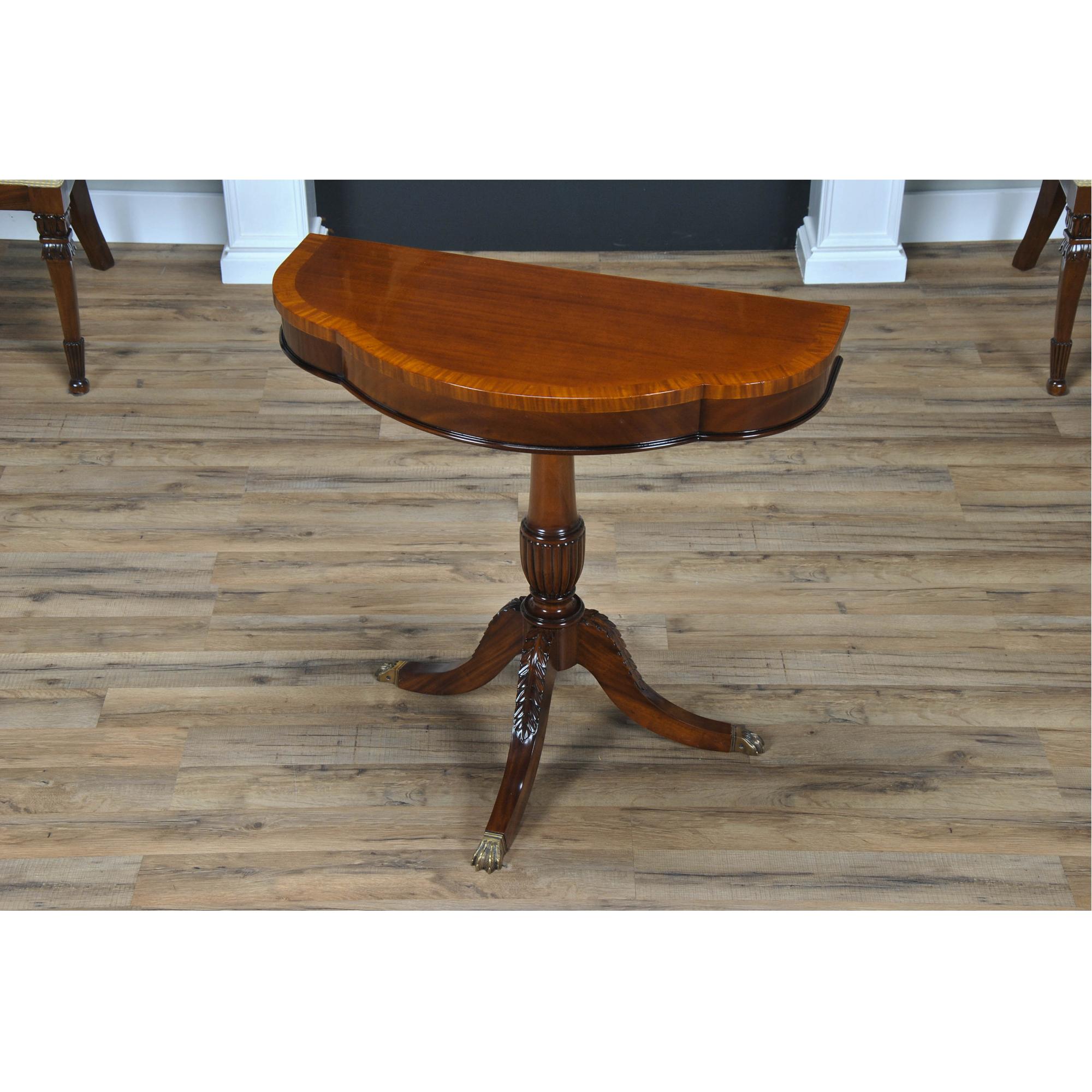 A great value this high quality Duncan Phyfe Console has made the top sellers list for years. Based on an antique design our reproduction console features a shaped mahogany top with satinwood banding is fastened on a central column with three hand