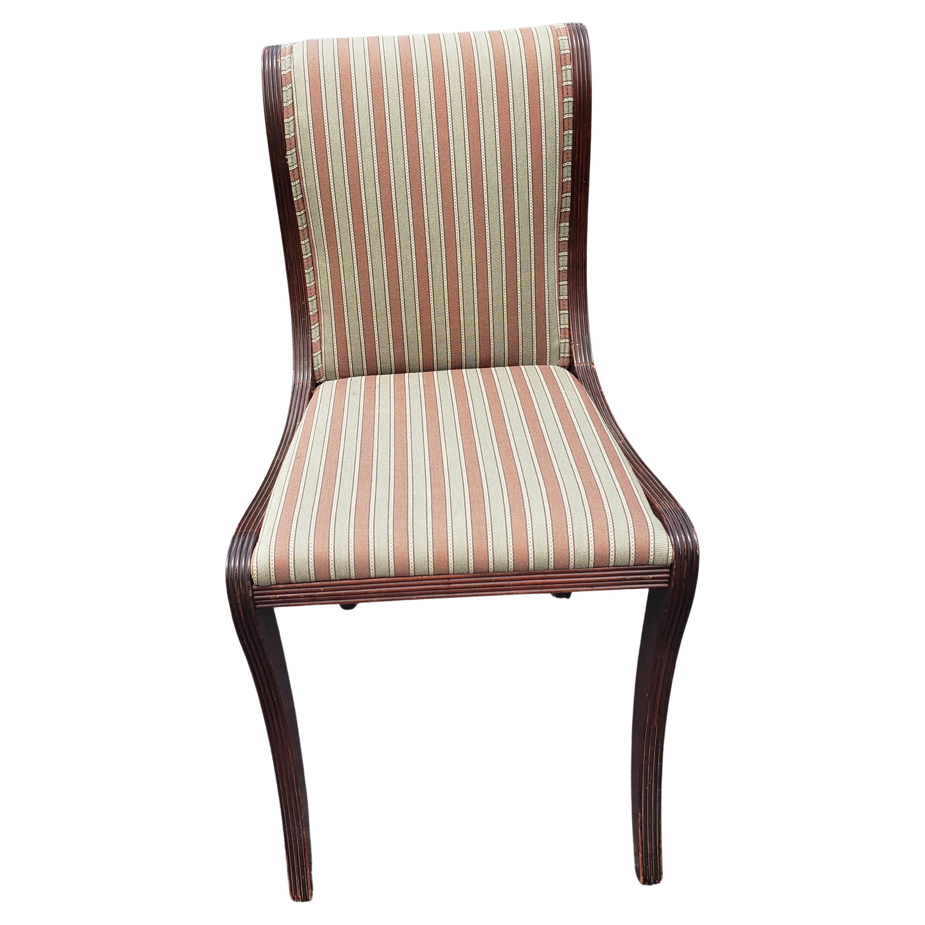 A Pair Duncan Phyfe Style Mahogany chairs with striped Upholstery. Very good vintage condition.
Chairs have been reupholstered down the road. Measure 17