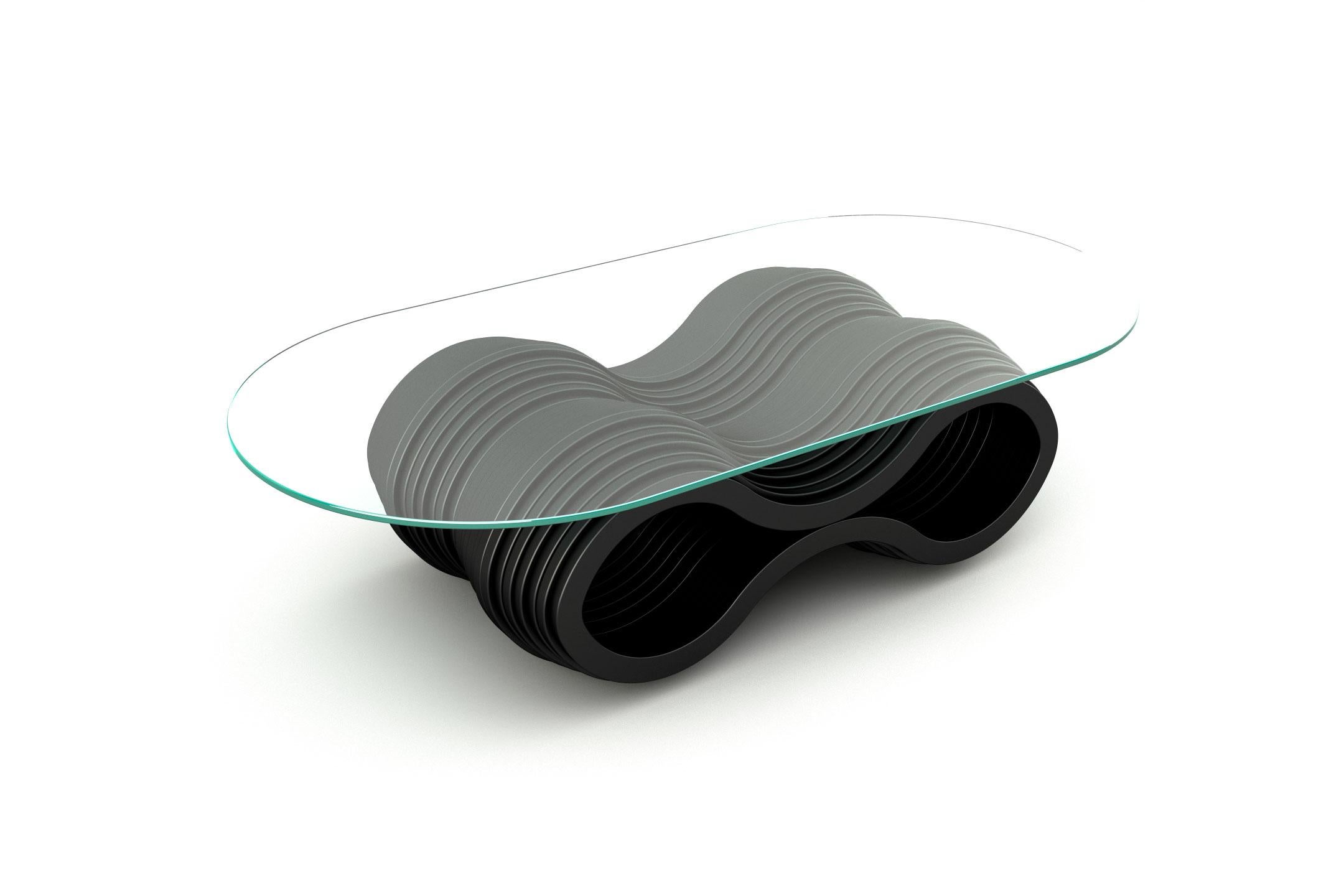 Coffee table manufactured from resilient layers of lacquered wood which evoque the curvaceous beauty of the sandy dunes. Its structure is shaped from lacquered and cut layers of wood with a round toughened clear glass top which can be customized to