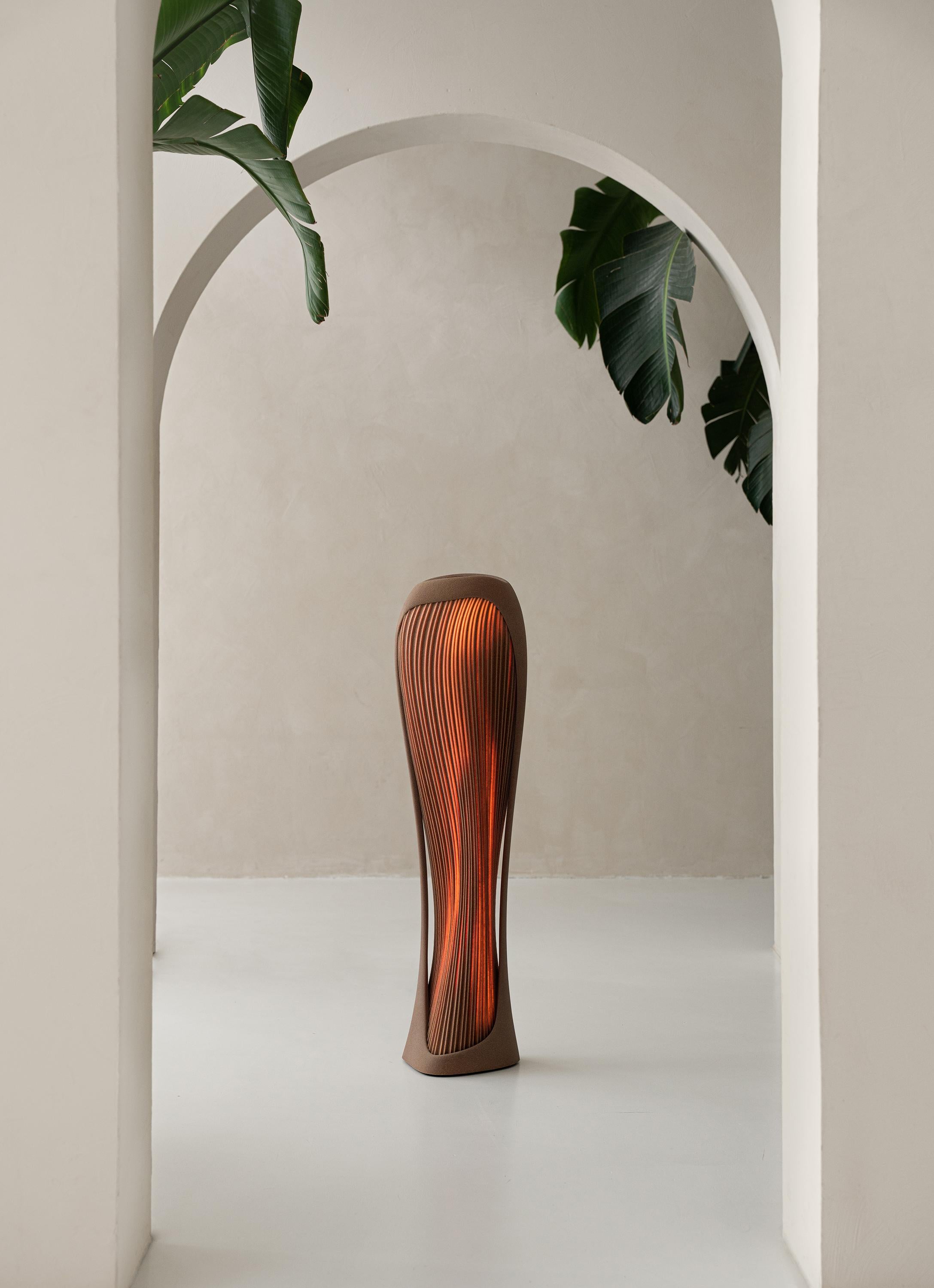 Introducing the Para Dune table lamp, an exquisite piece of functional art that transcends the boundaries of contemporary lighting. Inspired by the hauntingly beautiful formations of desert dunes at dusk, this piece is a fusion of organic form and