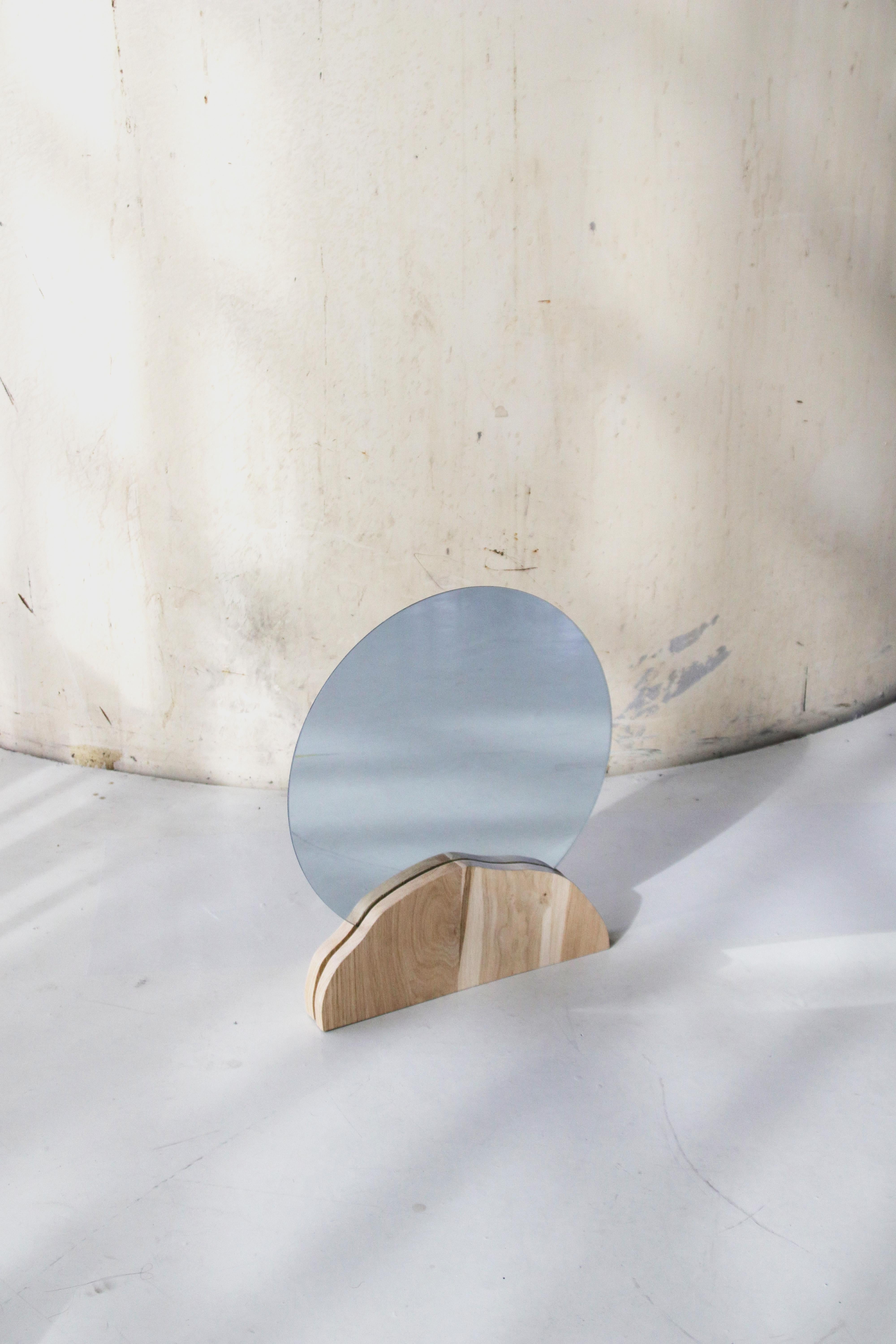 Dune mirror by Alice Lahana Studio
Every mirror is unique.
Dimensions: 42 x 55 cm
Materials: Oak.

Shaped by hand, the oak base hugs a large round mirror.

Alice Lahana is a french designer based in Paris. While studying at Ensba, she moved