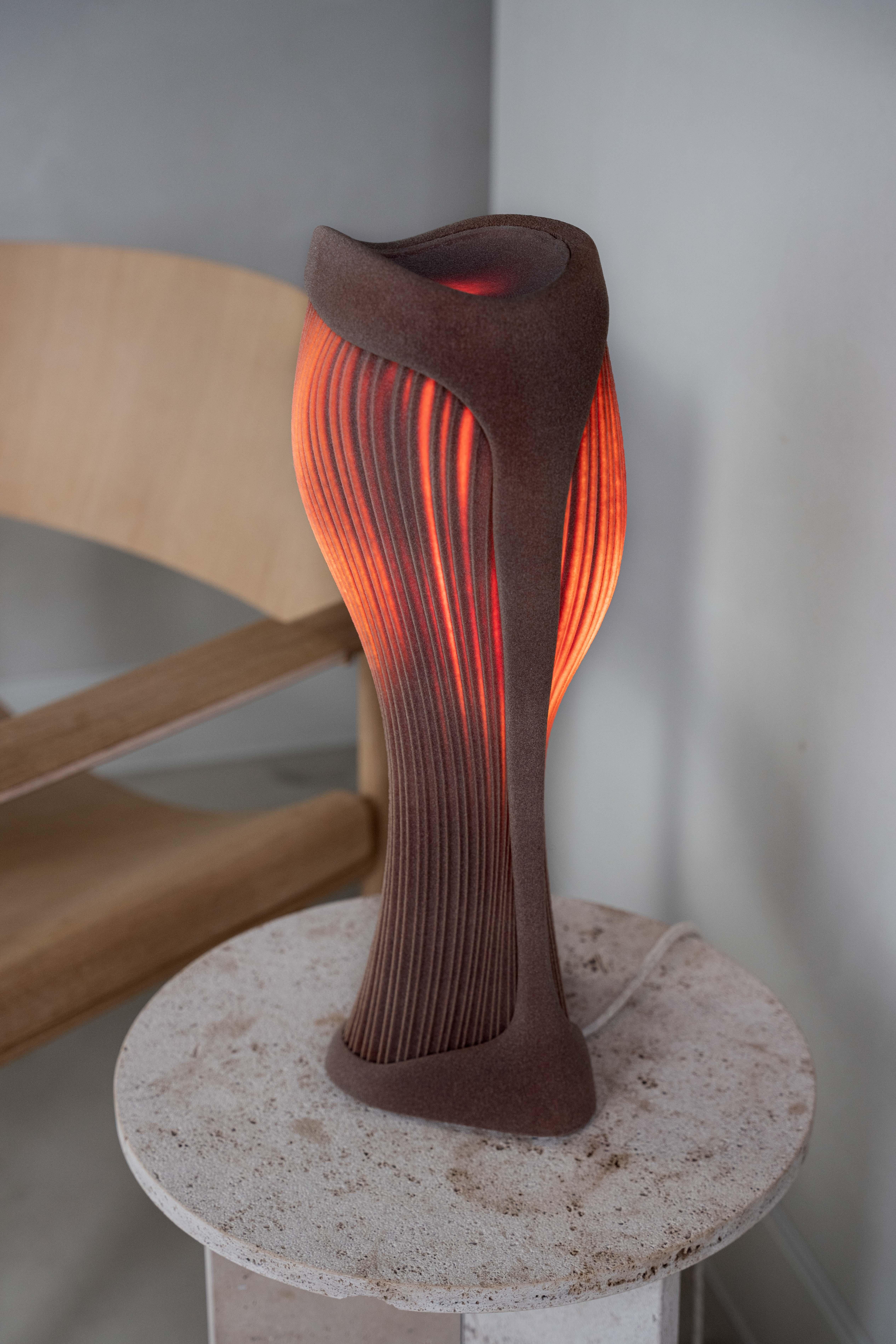 The Para table lamp, part of the Dune Collection, was inspired by the natural beauty of the desert landscape, and has been meticulously crafted using advanced 3D printing technology from quartz sand.

The lamp emanates a warm, ambient glow that