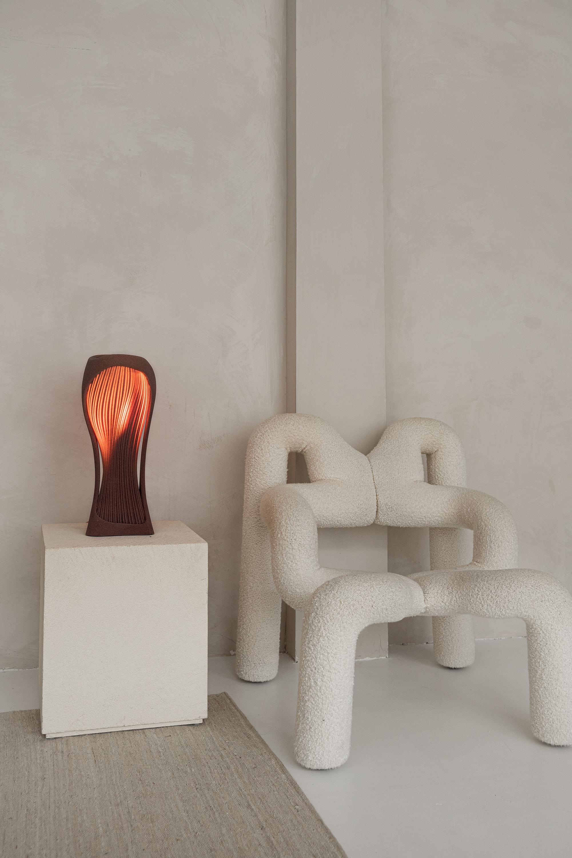 The Para table lamp, part of the Dune Collection, was inspired by the natural beauty of the desert landscape, and has been meticulously crafted using advanced 3D printing technology from quartz sand.

The lamp emanates a warm, ambient glow that