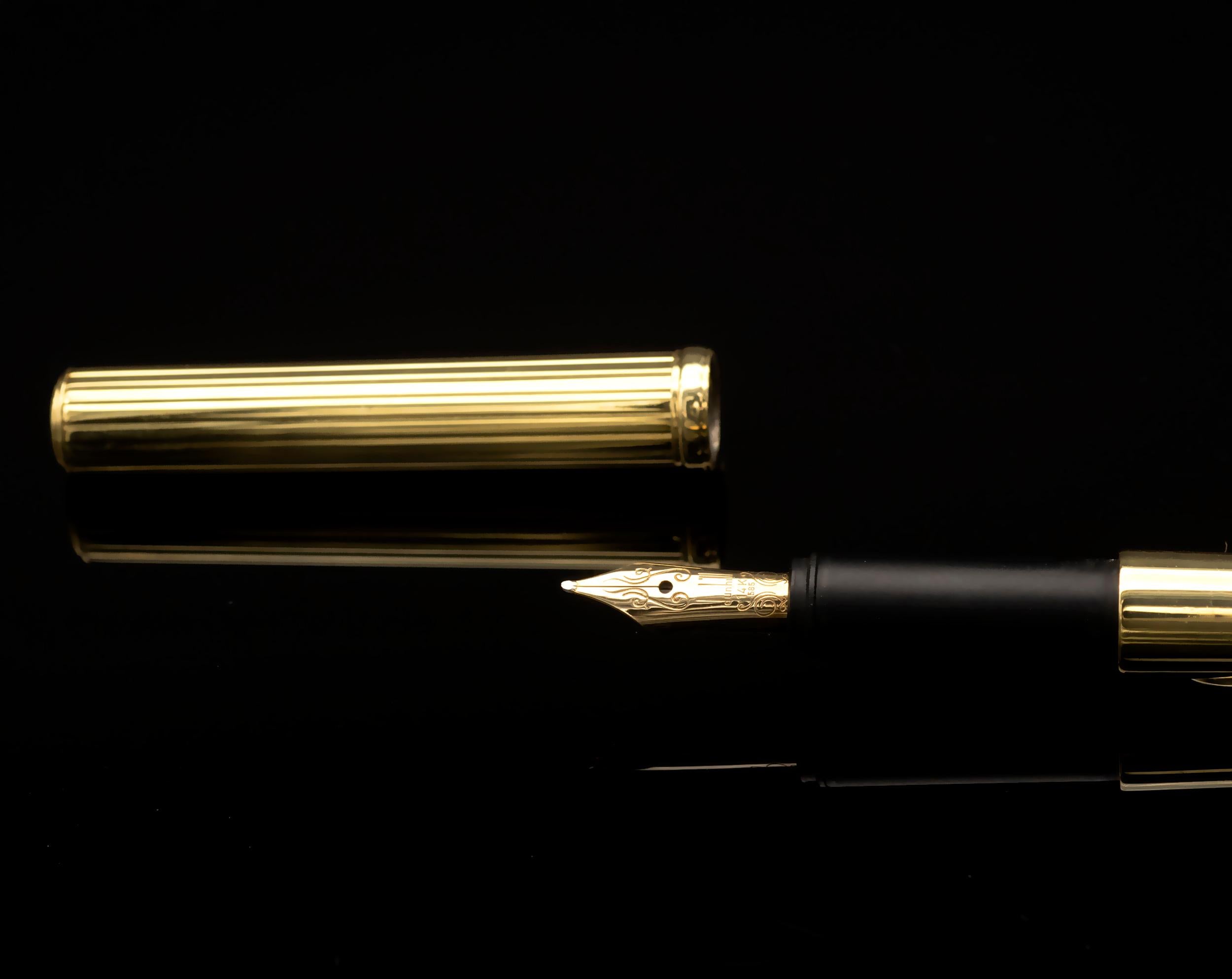 Extraordinary Dunhill pen in solid 18 karat yellow Gold with in its midst a line of diamonds set on White gold. The Dunhill Nib is 14 kt gold. 
Incredibly refined design and superb craftsmanship quality for a rare item. mint condition, original