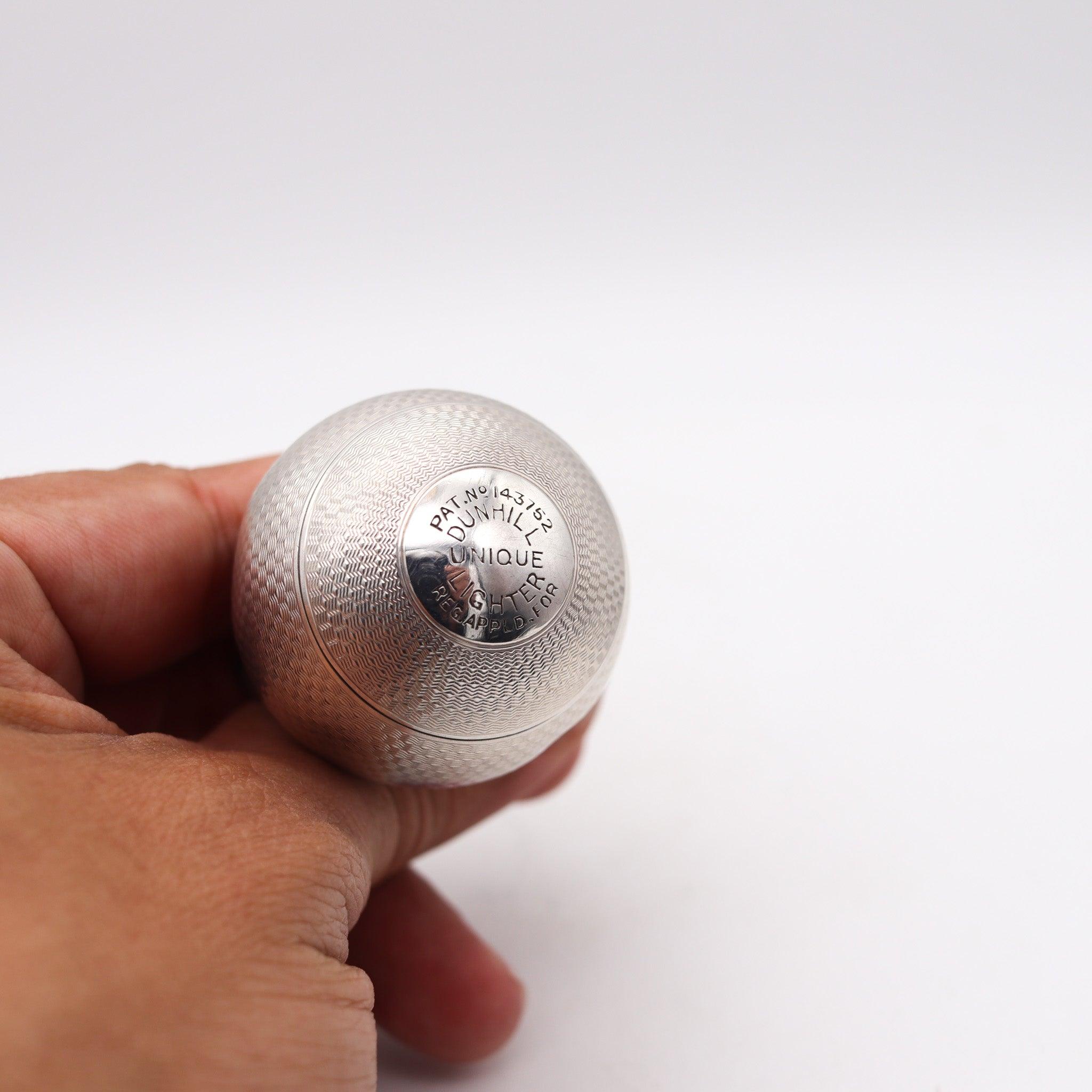 Ball desk lighter designed by Alfred Dunhill

This is a rare antique desk lighter, created in London England by the luxury brand of Alfred Dunhill, back in the 1929. The unusual lighter is the iconic ball shaped model named Unique with the Dunhill