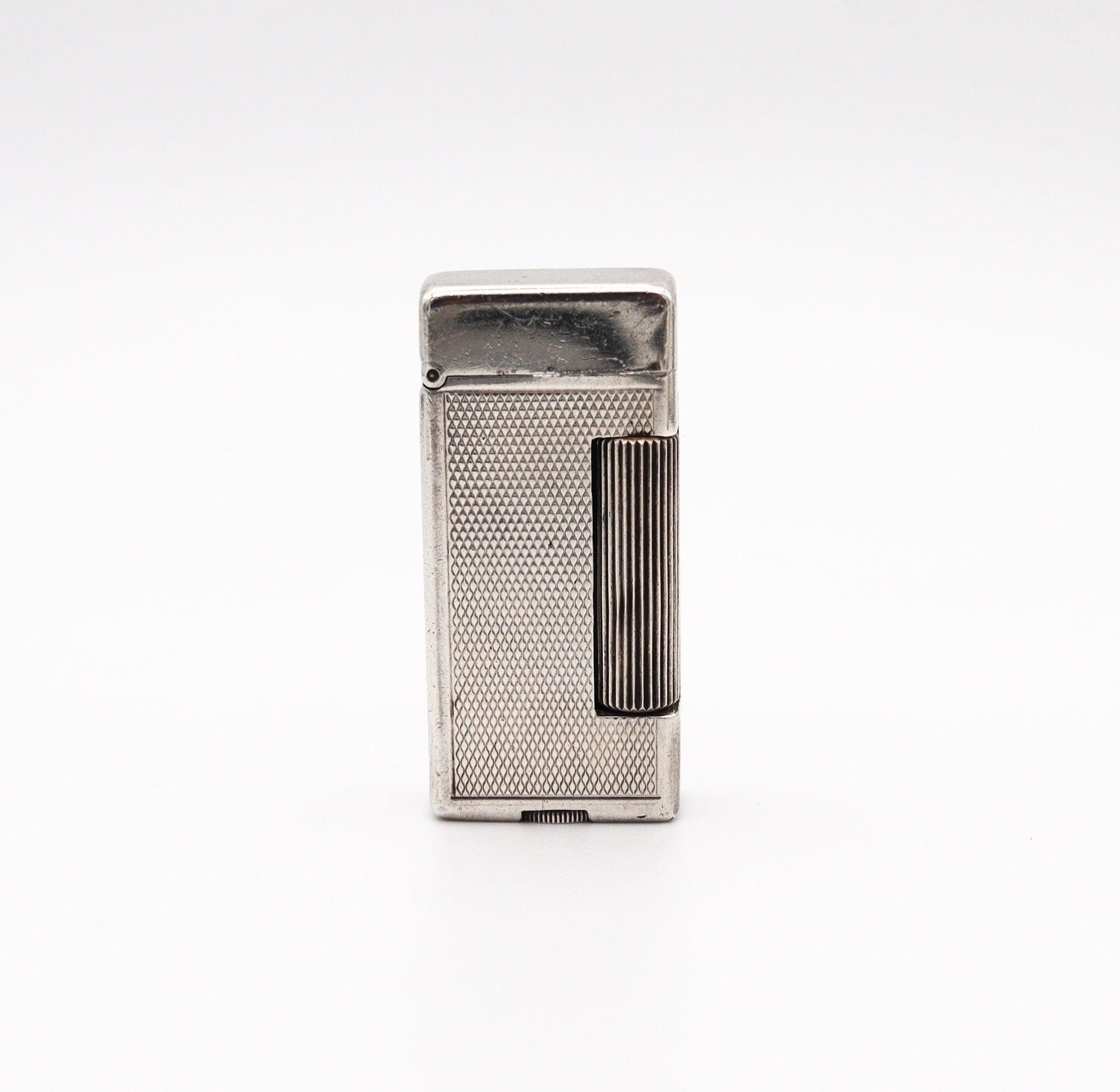 A rollalite lighter designed by Alfred Dunhill

This is a very scarce petrol pocket lighter, created in Switzerland by La Nationale company for the Alfred Dunhill Company in London England, back in the 1936. This semi-automatic lighter is the iconic