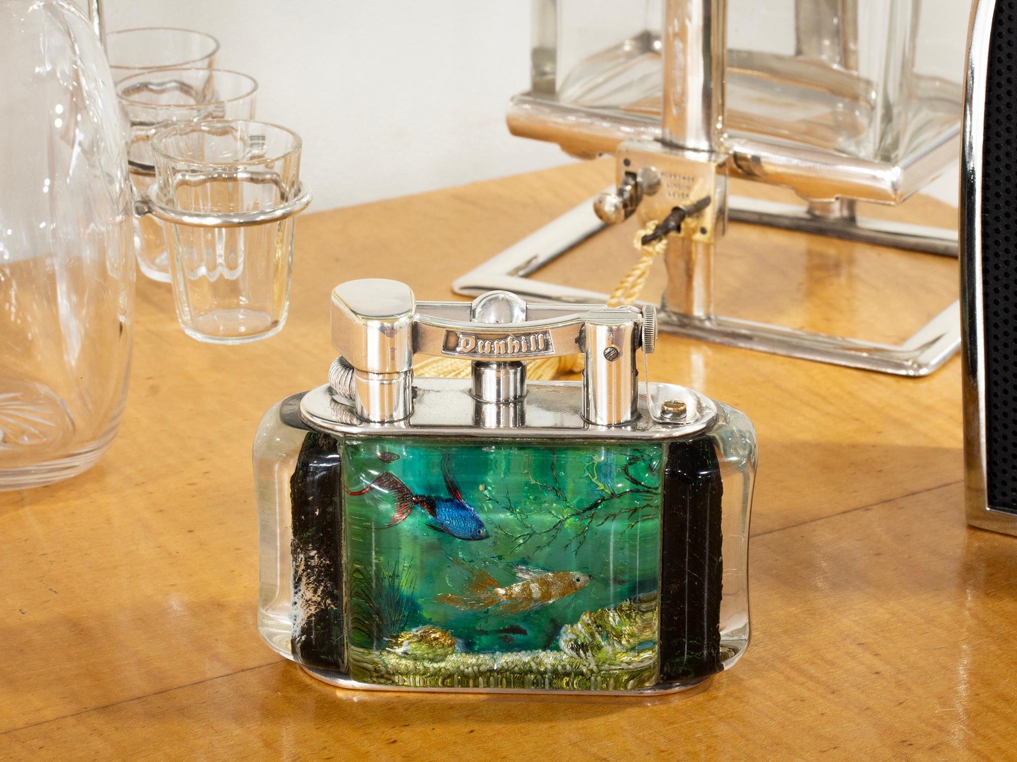 Novelty Google Eyed Fish

From our Accessories collection, we are delighted to offer this Dunhill Aquarium Half-Giant Table Lighter. The Aquarium Lighter with a Silver Plated body features a lucite aquarium body with novelty swimming fish, one side