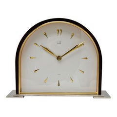 Reloj de sobremesa abovedado de latón y madera Dunhill, hacia 1940