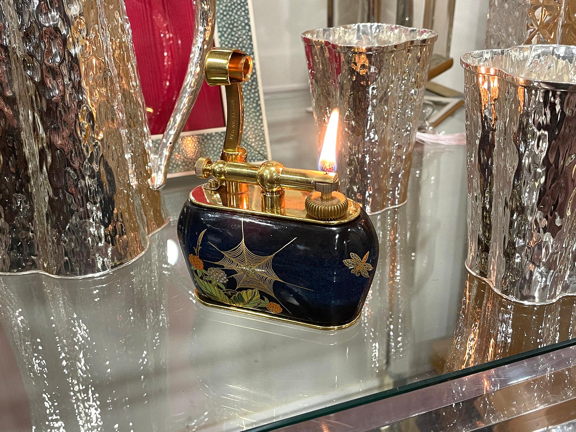 Alfred Dunhill Lighter Circa 1957

From our Accessories collection, we are delighted to offer this Dunhill ‘Carlton’ Spider Web Table Lighter. The Lighter Gold Plated lighter was produced in partnership with Carlton Ware with the ceramic body