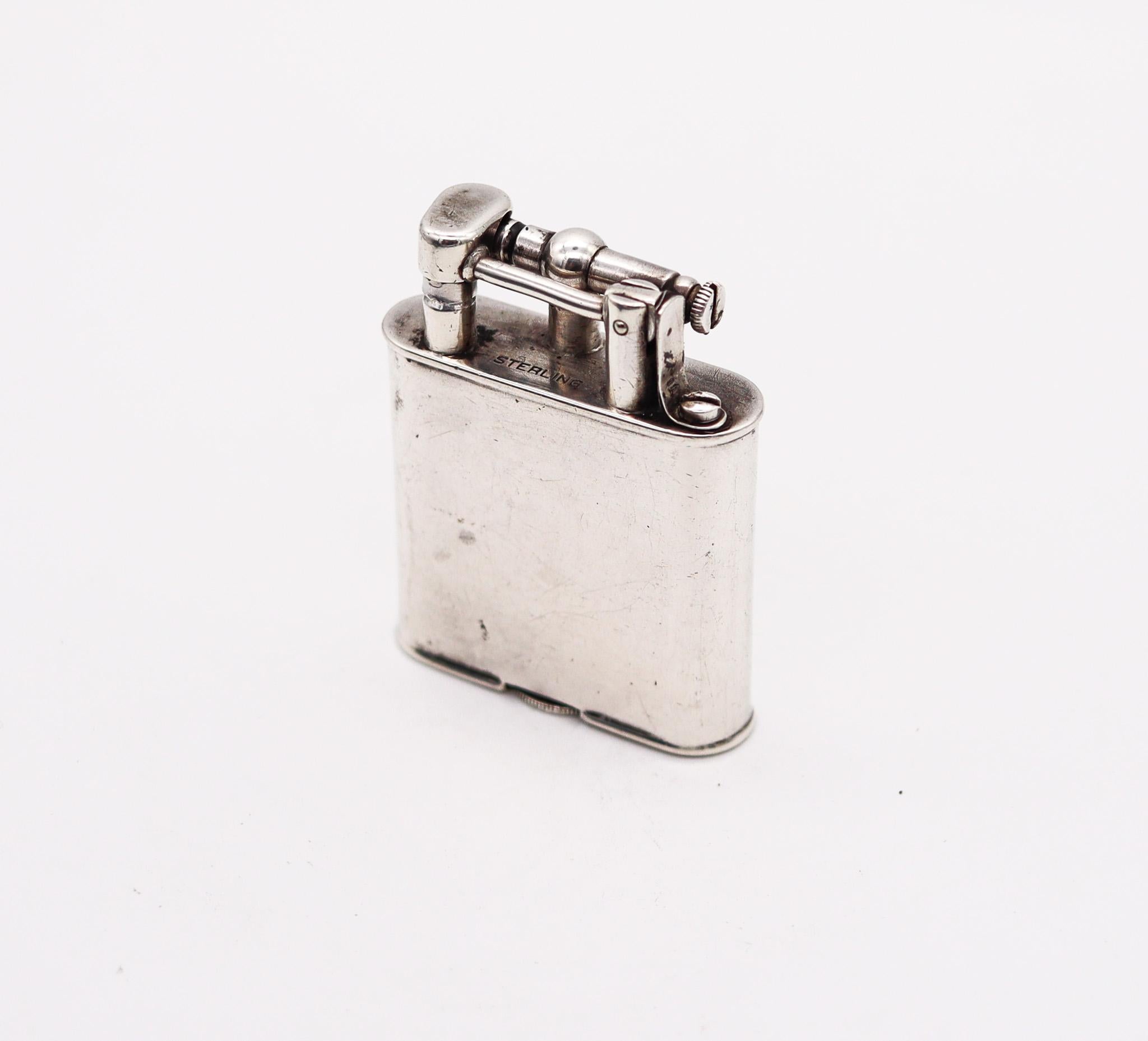 Unique petrol lighter designed by Dunhill.

Beautiful lift arm petrol lighter, designed by the Alfred Dunhill Company during the Art Deco period, circa 1927-30. It was crafted in solid .925/.999 sterling silver with high polished finish. In 1927,