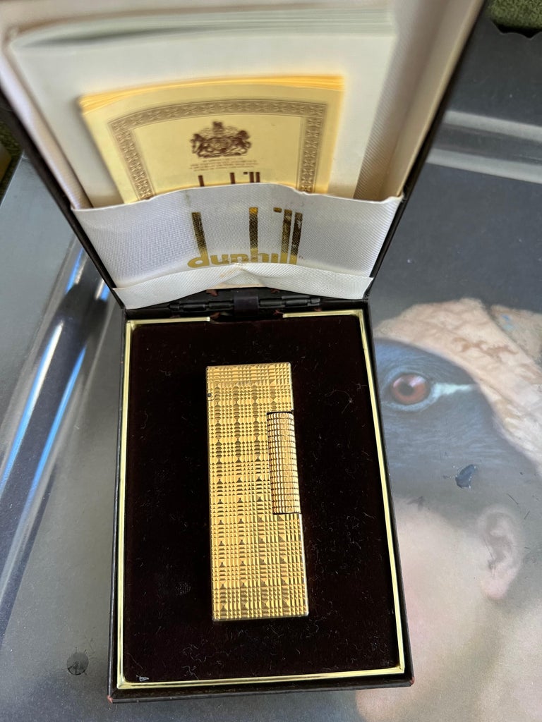 dunhill gold cigarettes Evoke (CTN) The Dunhill Moire Rollagas Gold Plate Lighter is a symbol of timeless luxury and impeccable craftsmanship The Original James Bond Dunhill