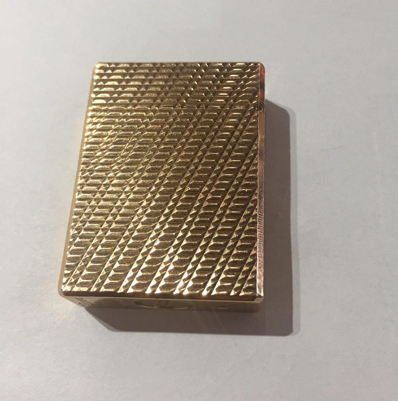 Dupont yellow gold-plated butane gas cigar cigarette lighter, marked: S.T. Dupont Paris made in France W 1993 and Dupont Logo, approximate size: 1.75