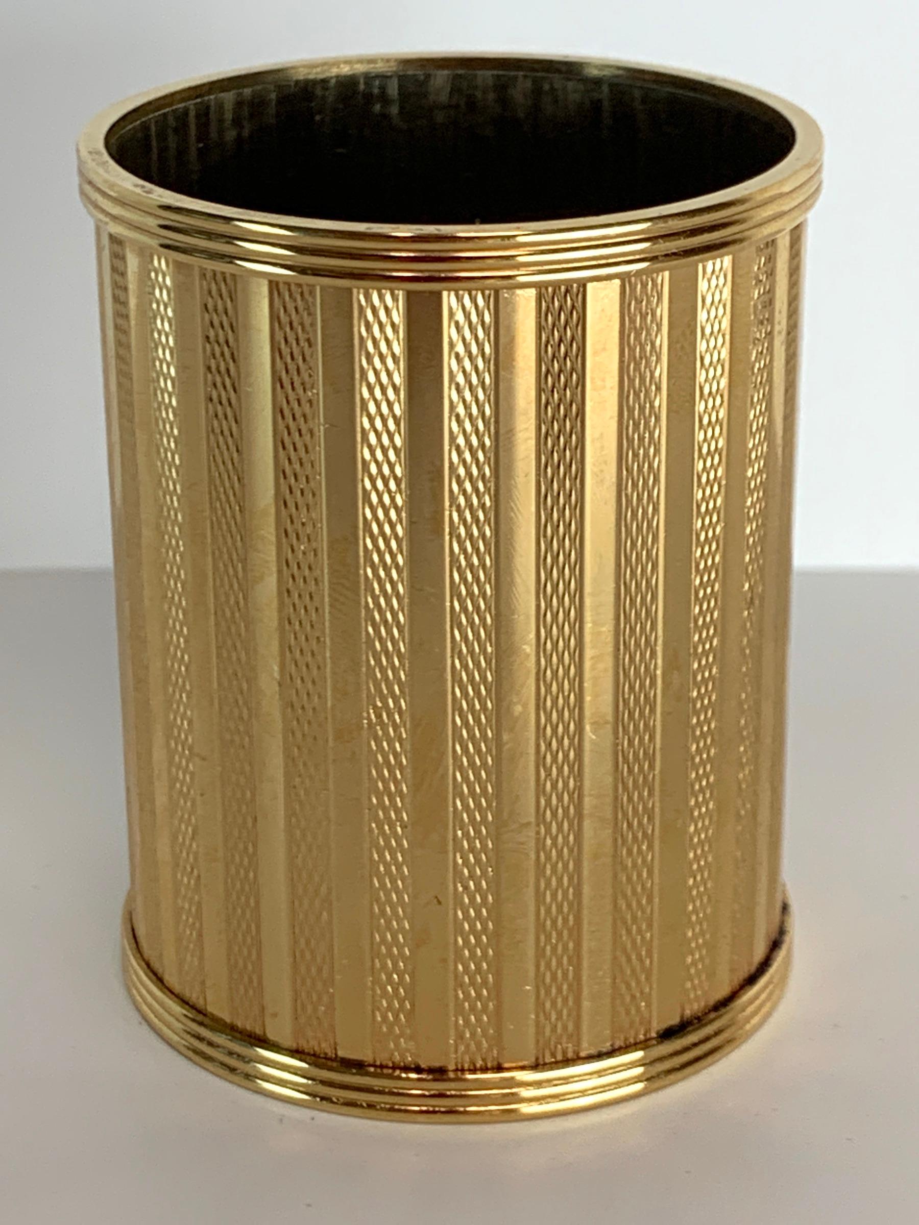 Dunhill gold-plated smoking stand, Paris, circa 1950, beautifully crafted, high quality, with continuous decoration solid and engine turned stripes, very heavy gold plating, presents beautifully.