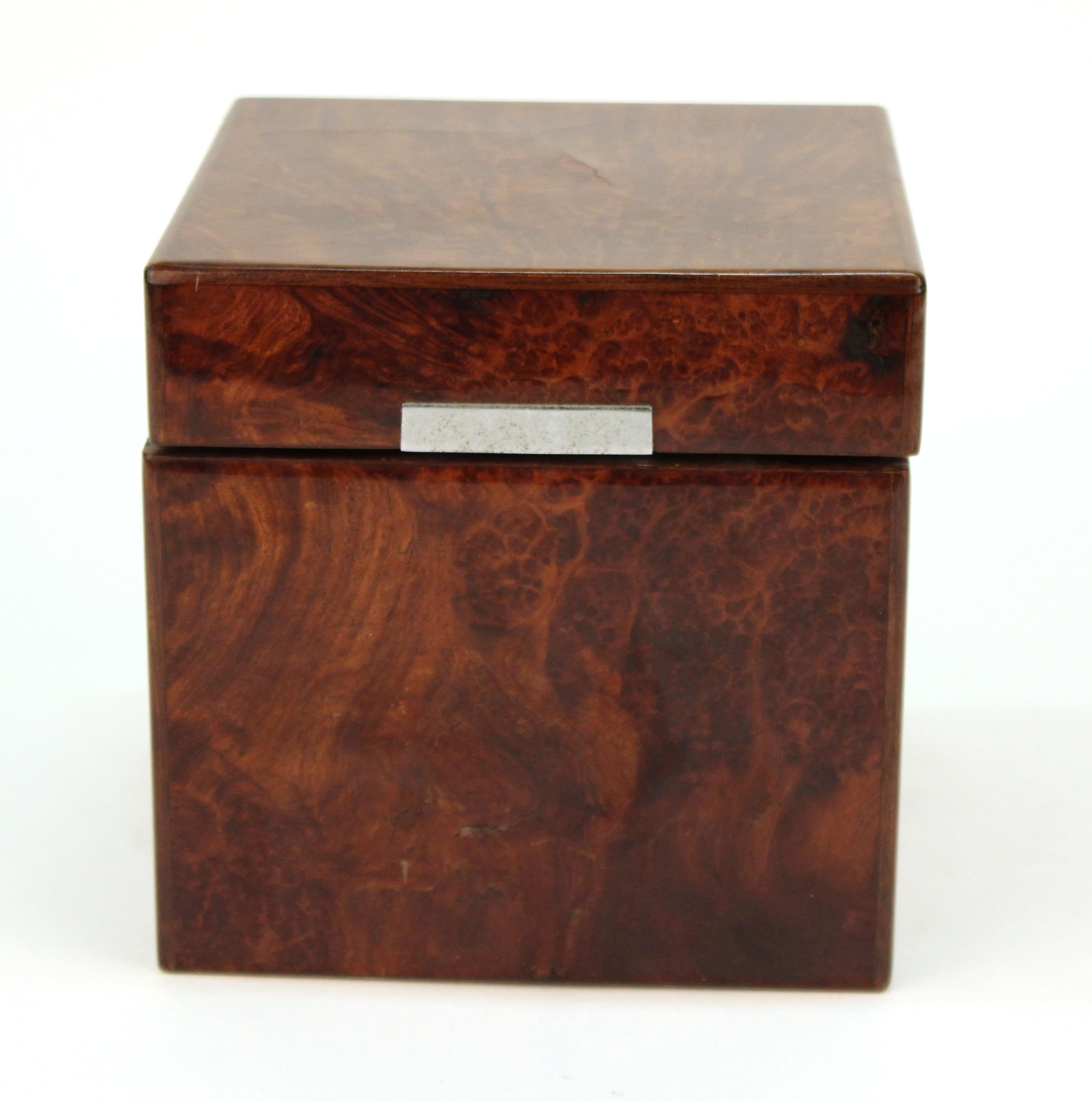 Dunhill exotic wood humidor in square form, with milk glass liner and a silvered metal moistener affixed to inner lid. The underside is marked with a 