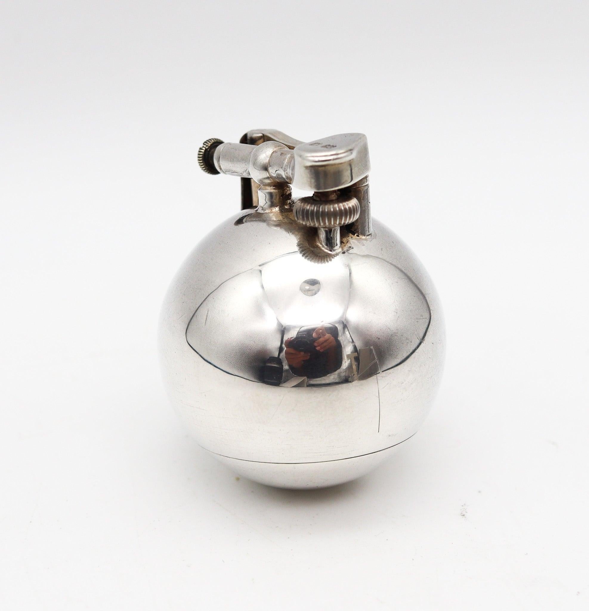 Ball desk petrol lighter designed by Alfred Dunhill

This is a rare antique desk liquid-petrol lighter, created in London England by the luxury brand of Alfred Dunhill, back in the 1929. The unusual lighter is the iconic ball shaped model named
