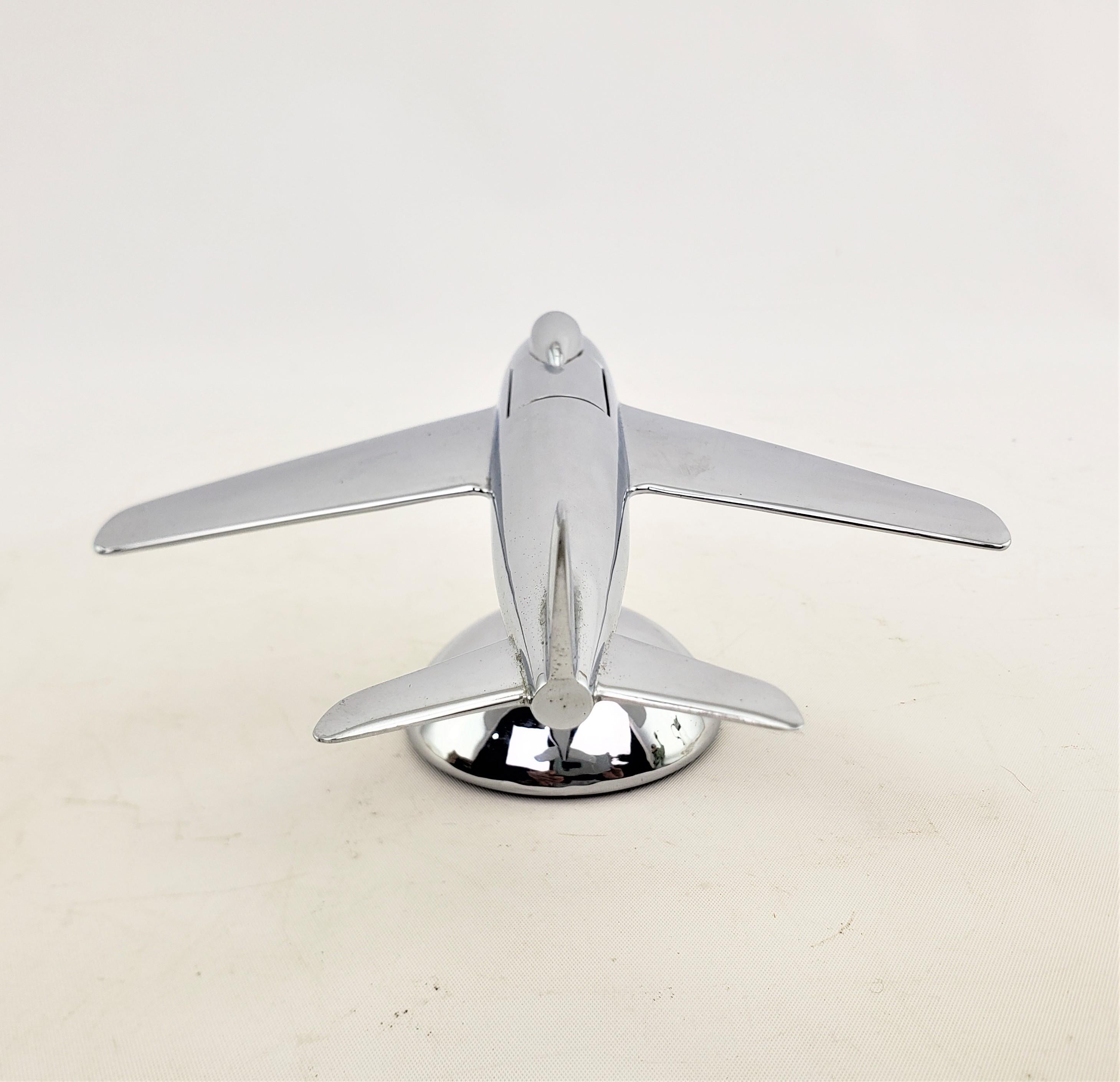 Metal Dunhill Mid-Century Modern Chrome Stylized Sabre Jet Airplane Table Lighter For Sale