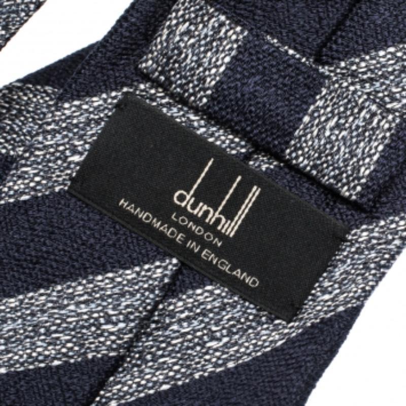 Defined by a diagonal stripe pattern in jacquard, this tie is tailor-made for the modern man. It has been cut from mulberry silk and detailed with the label and the keeper loop on the back. Get a polished look with this smart Dunhill tie.