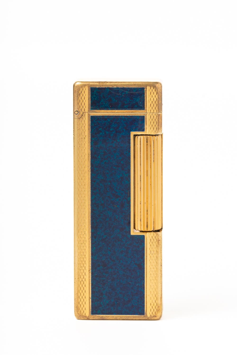 Iconic and timeless gold-plated Dunhill lighter with very elegant and luxurious Chinese blue lacquer. The lighter is in good vintage and in full working condition; The lighter is stamped on the base: 'Dunhill', 'SWISS MADE', serial number '24163'.