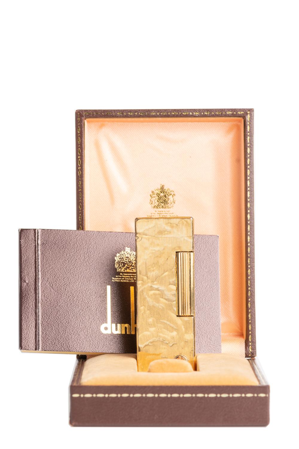 A classic and elegant Dunhill Rollagas Lighter with a fantastic abstract texture. The lighter comes with an original box and papers. Stamped on the base 'Dunhill' and 'SWISS MADE' with a 'd' mark on the front. This a great birthday gift for someone