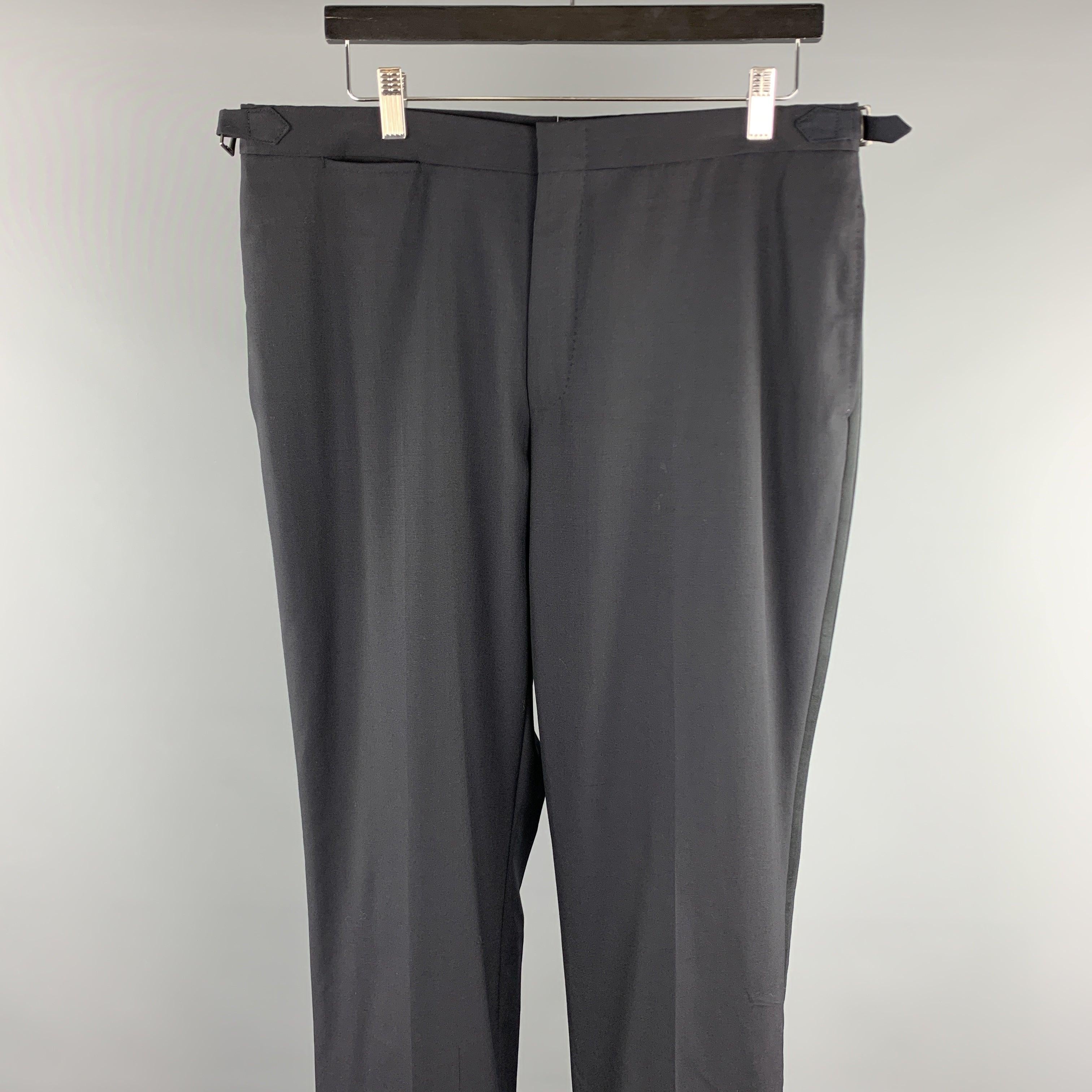 DUNHILL dress pants comes in a black wool featuring a tuxedo style, side tabs, and a zip fly closure.
Excellent
Pre-Owned Condition. 

Marked:   ( No Sized Marked ) 

Measurements: 
  Waist: 34 inches Rise: 10 inches 
Inseam: 32 inches 
  
  
