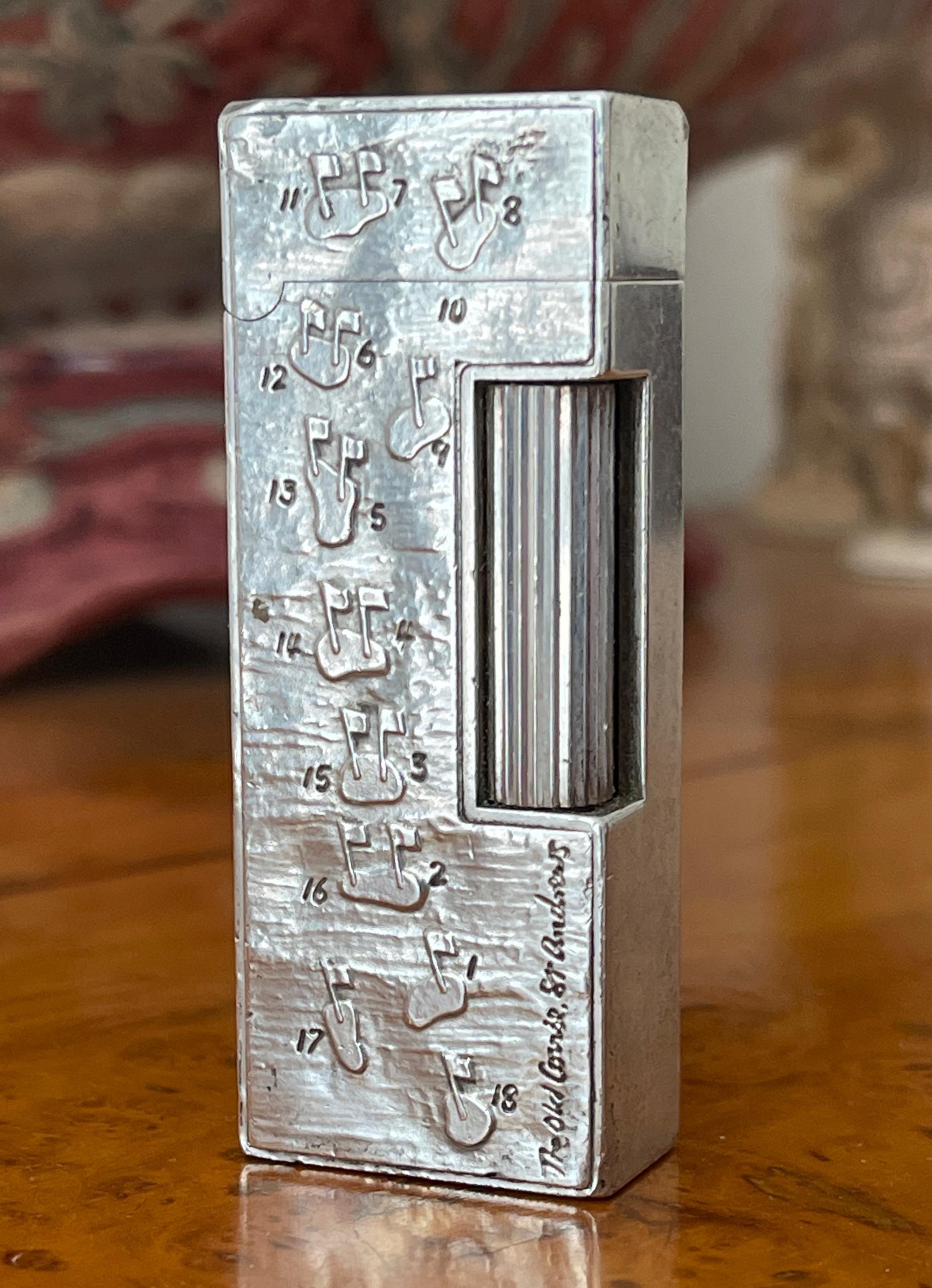 Dunhill English Silver The Old Course St Andrews Royal and Ancient Golf Club Limited Edition from their ‘Great Golf Courses Of The World’ collection rollagas butane lighter designed by Harold Riley. 
Edition 144/288 with a city stamp of London,