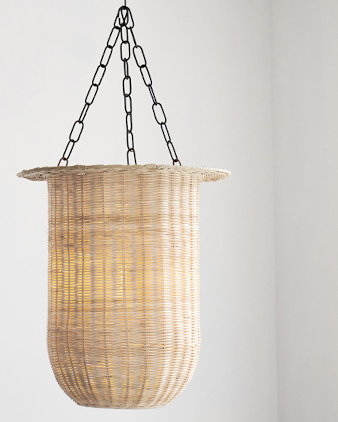 Handwoven Rattan in Indonesia. 
Designed by Dunlin. 

Dunlin's exquisitely crafted Hurricane Lantern Pendant - a stunning addition to any interior space. This pendant boasts elegant, perfectly proportioned lines that are accentuated by its unique