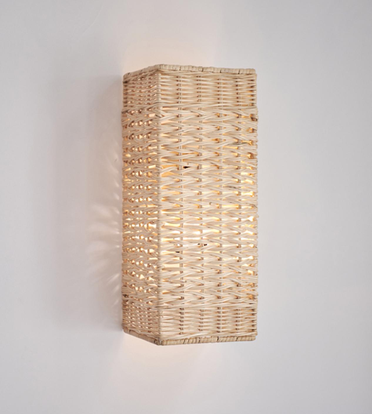 Handwoven Rattan in Indonesia.
Designed by Dunlin.
An elegant, perfectly proportioned rattan wall sconce designed by Dunlin. Timeless in form and impeccable in execution, these are ideal sconces to frame artwork, crown a fireplace or run along a