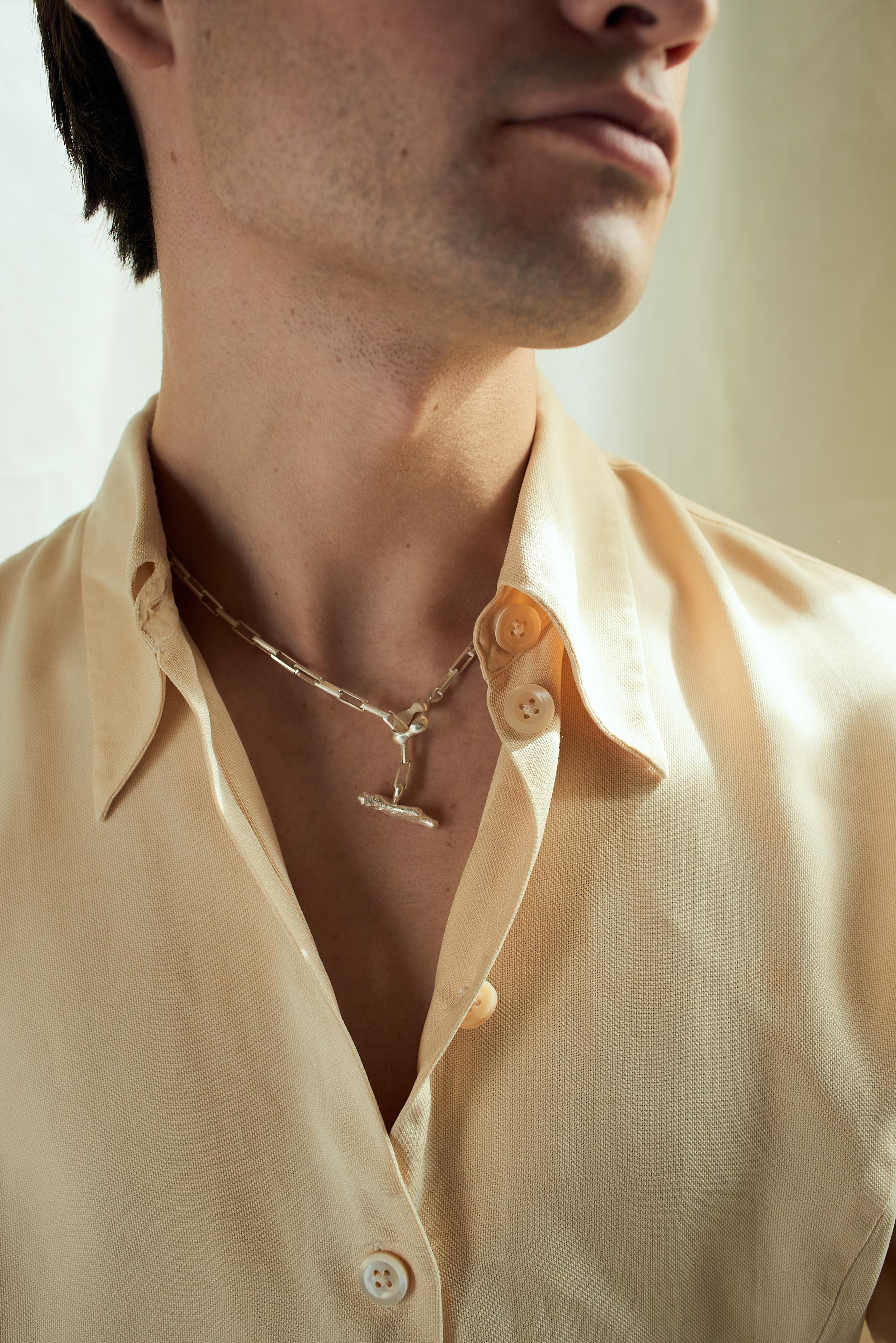
The Dunton Ellerkamp necklace features the signature Dunton Ellerkamp clasp hardware that functions as both a clasp and a pendant. Assembled in solid sterling sterling with an Italian sterling silver chain.

Each piece is hand carved, cast, and