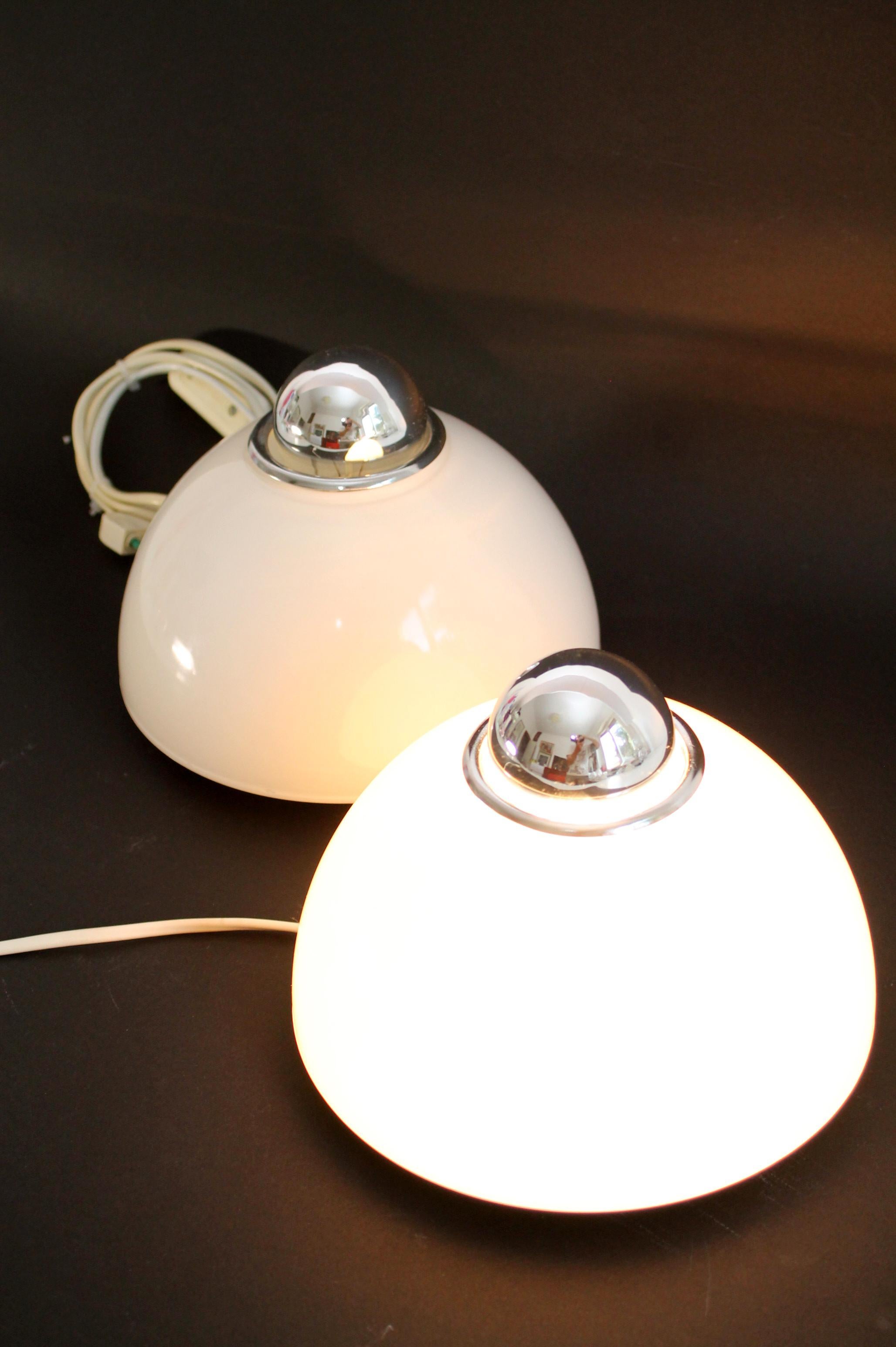 Artemide Tilos 200 by E. Gismondi, 1990s. Wall or ceiling lamp
Designer: Ernesto Gismondi
Producer: Artemide
Model: Tilos 200
Socket bulb E27 (can be used with a Crown silver bulb or a simple white glass 3000K LED). Different lighting results but