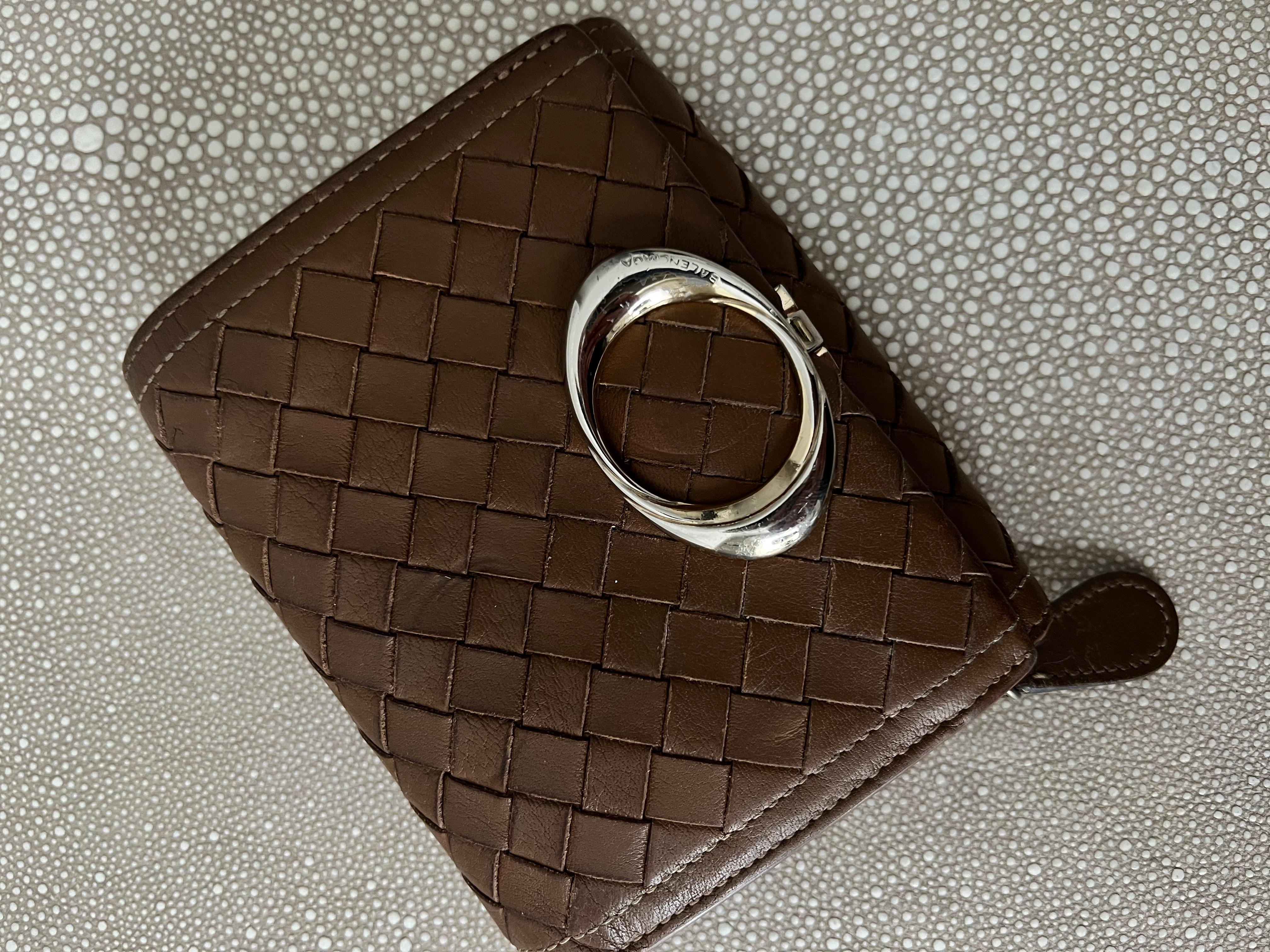 A Sexy Italian Balenciaga Woven Leather wallet with Brass Closure.  The piece is signed and numbered and authentic.

The piece will fit in a pocket or purse and has zippers for important pieces and change.  Space for 5 Credit cards - 

Very
