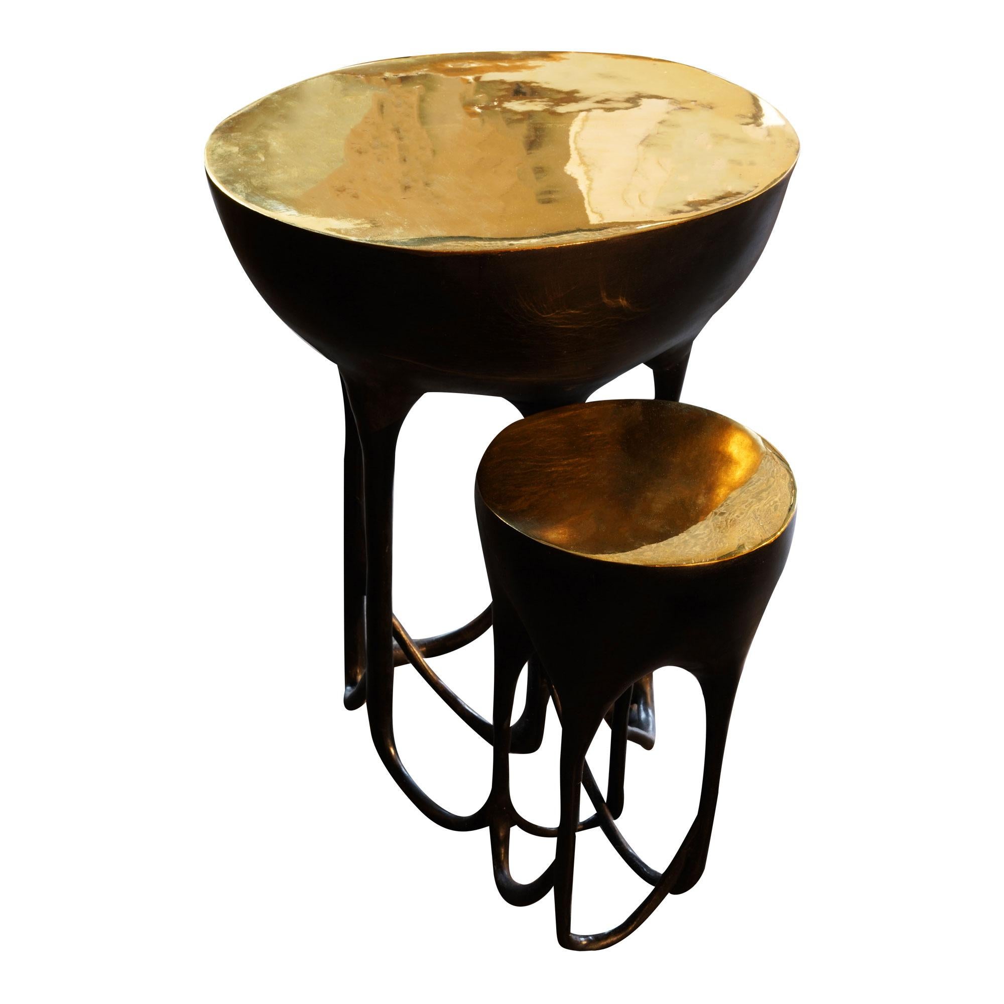 Elegant and intricate, this side table is made of polished and blackened bronze.

Can be customized.  The larger part of the table is 17
