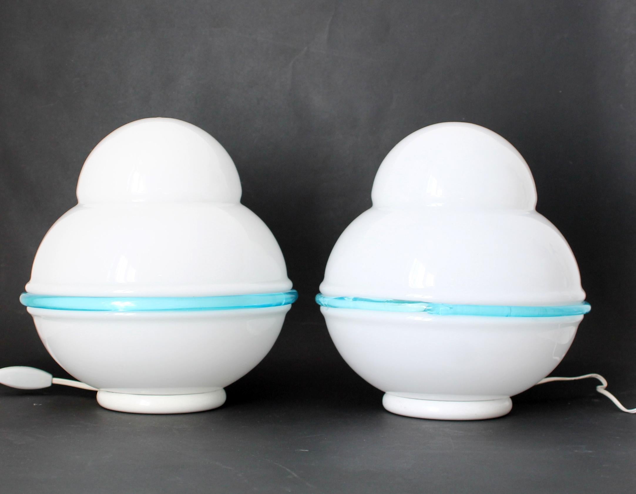 DUO )) original glass lamps by LEUCOS - Handmade in Italy (Murano  Venezia)
White opaline glass with a delicate light blue halo attached to it  from the 1970s
Measurements (cm): 26 height x 23 max diameter) 

Condition: Overall excellent. (SEE THE