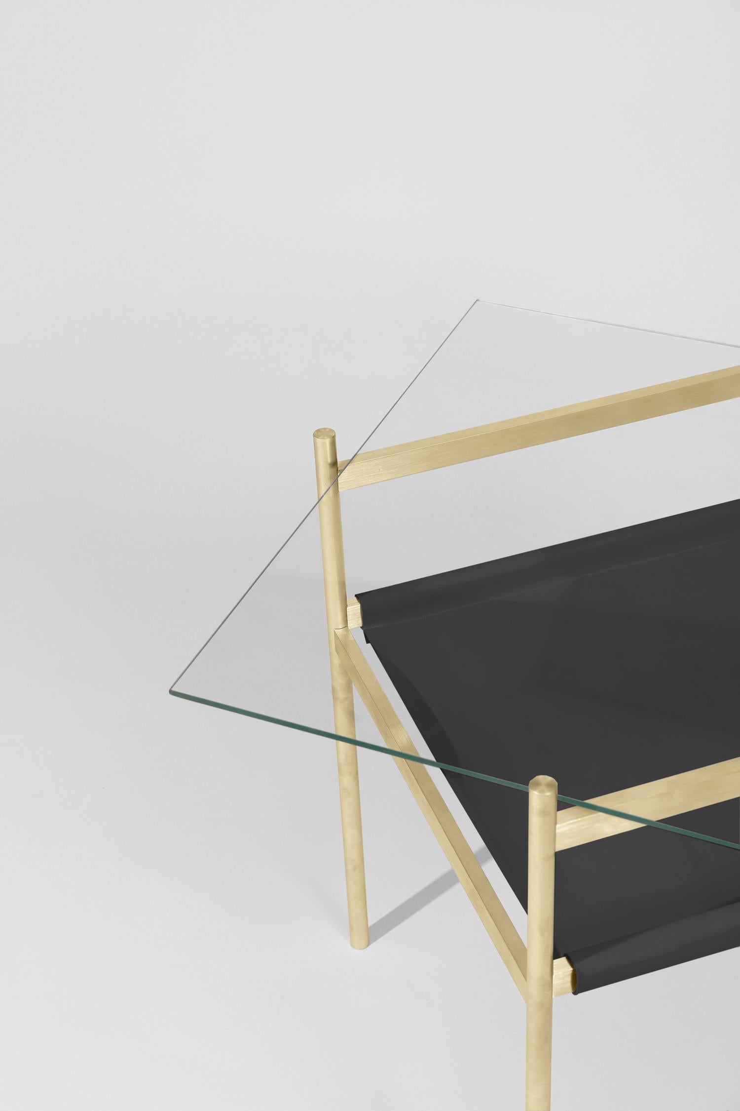 Made to order. Please allow six weeks for production.

Brass Frame / Clear Glass / Black Leather Sling

The Duotone Furniture series is based on a modular hardware system that pairs sturdy construction with visual lightness and a range of