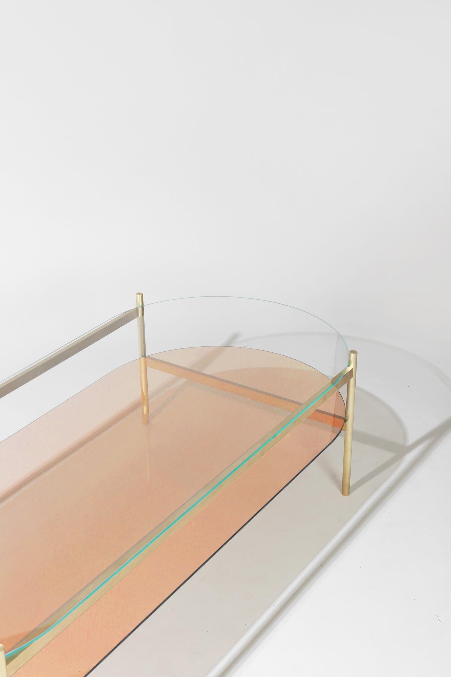 Made to order. Please allow 6 weeks for production.

Brass Frame / Clear Glass / Rose Glass

The Duotone coffee table is a commercial grade table made from precision machined solid brass. Each table is made locally in St. Augustine, Florida with